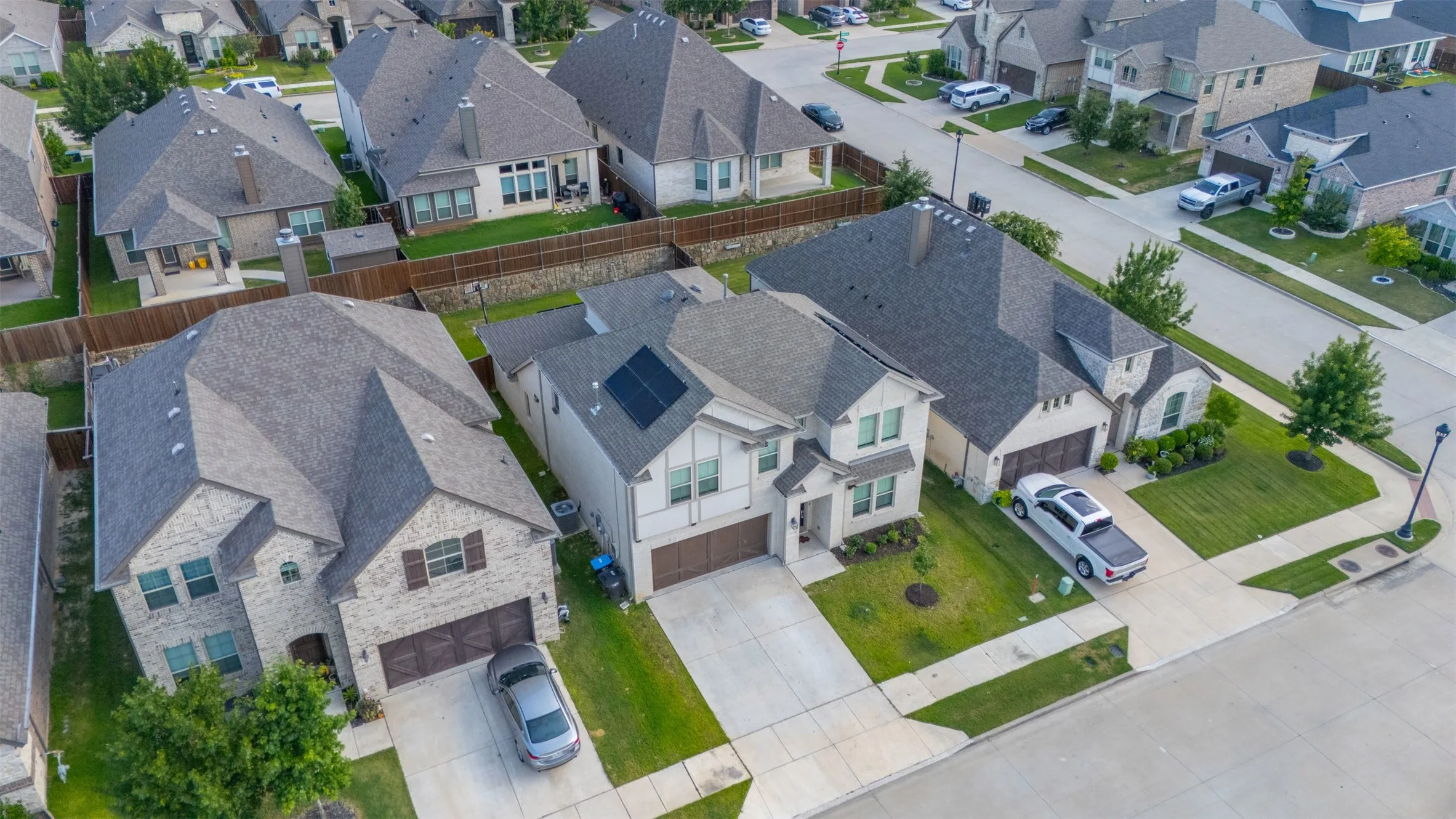 Aerial view at 5149 Cantle Ct in Fort Worth, Texas, Tarrant County, located on a cul-de-sac for minimal traffic and a flat lot with front landscaping and solar panels (paid off at closing) for energy efficiency.