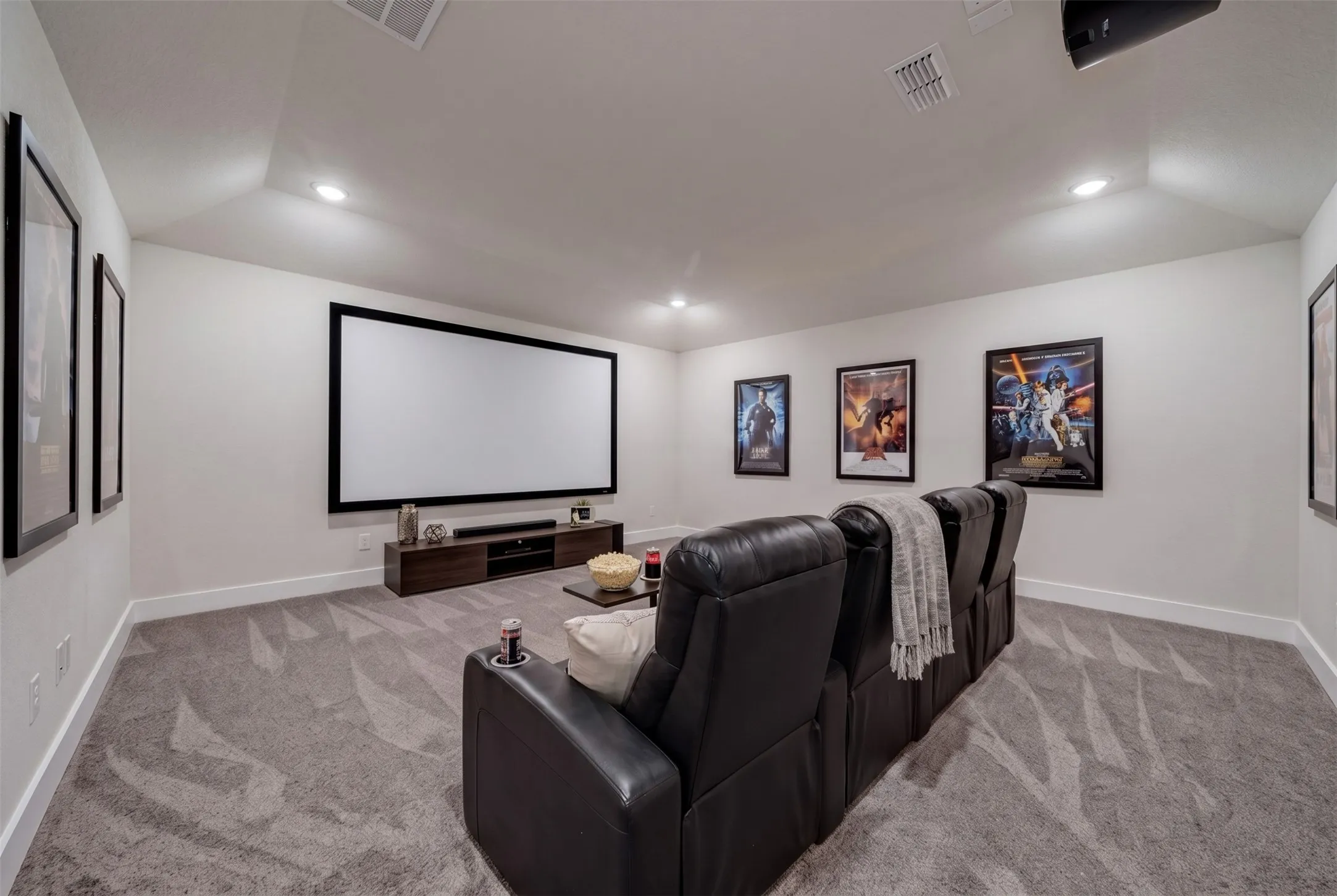 Virtually Staged Dedicated Media Room at 5149 Cantle Ct in Fort Worth, Texas, Tarrant County, with light colored carpet and no windows for prime viewing. Plenty of space to install a movie screen and project with theater style recliners.