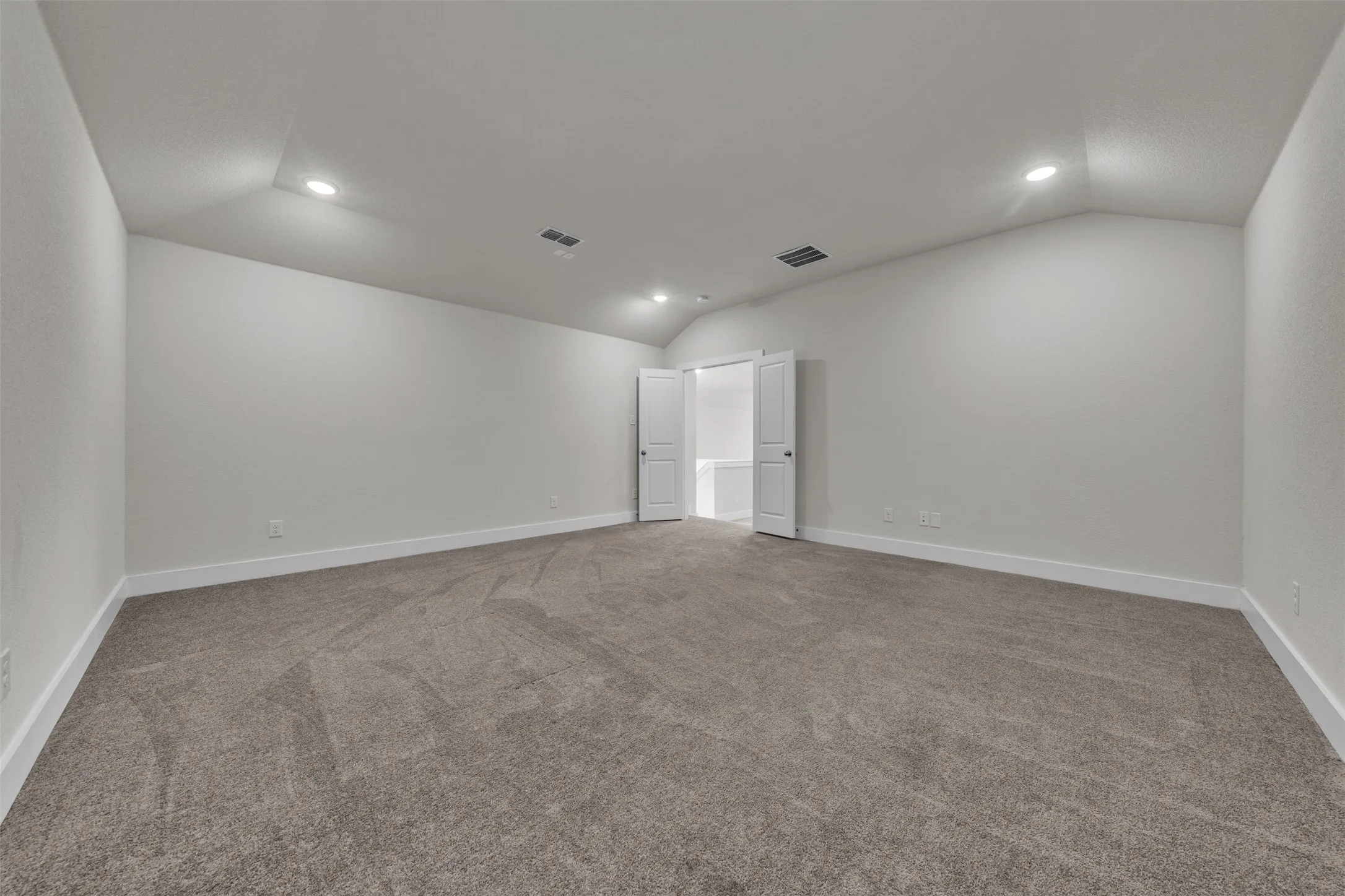 Dedicated Media Room at 5149 Cantle Ct in Fort Worth, Texas, Tarrant County, with light colored carpet and no windows for prime viewing. Plenty of space to install a movie screen and project with theater style recliners.
