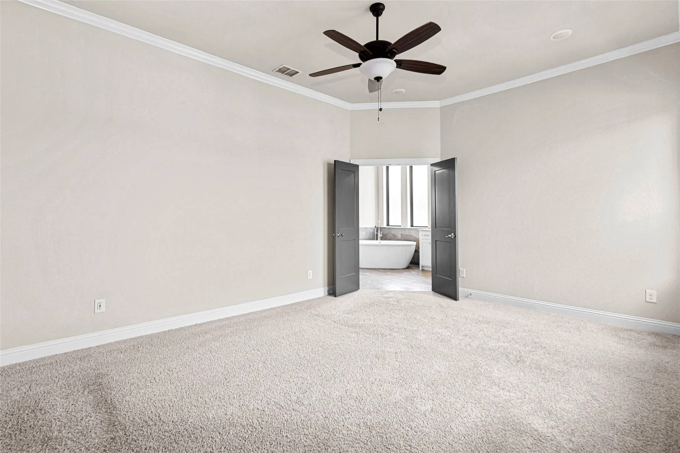 Upstairs primary bedroom with an ensuite bathroom