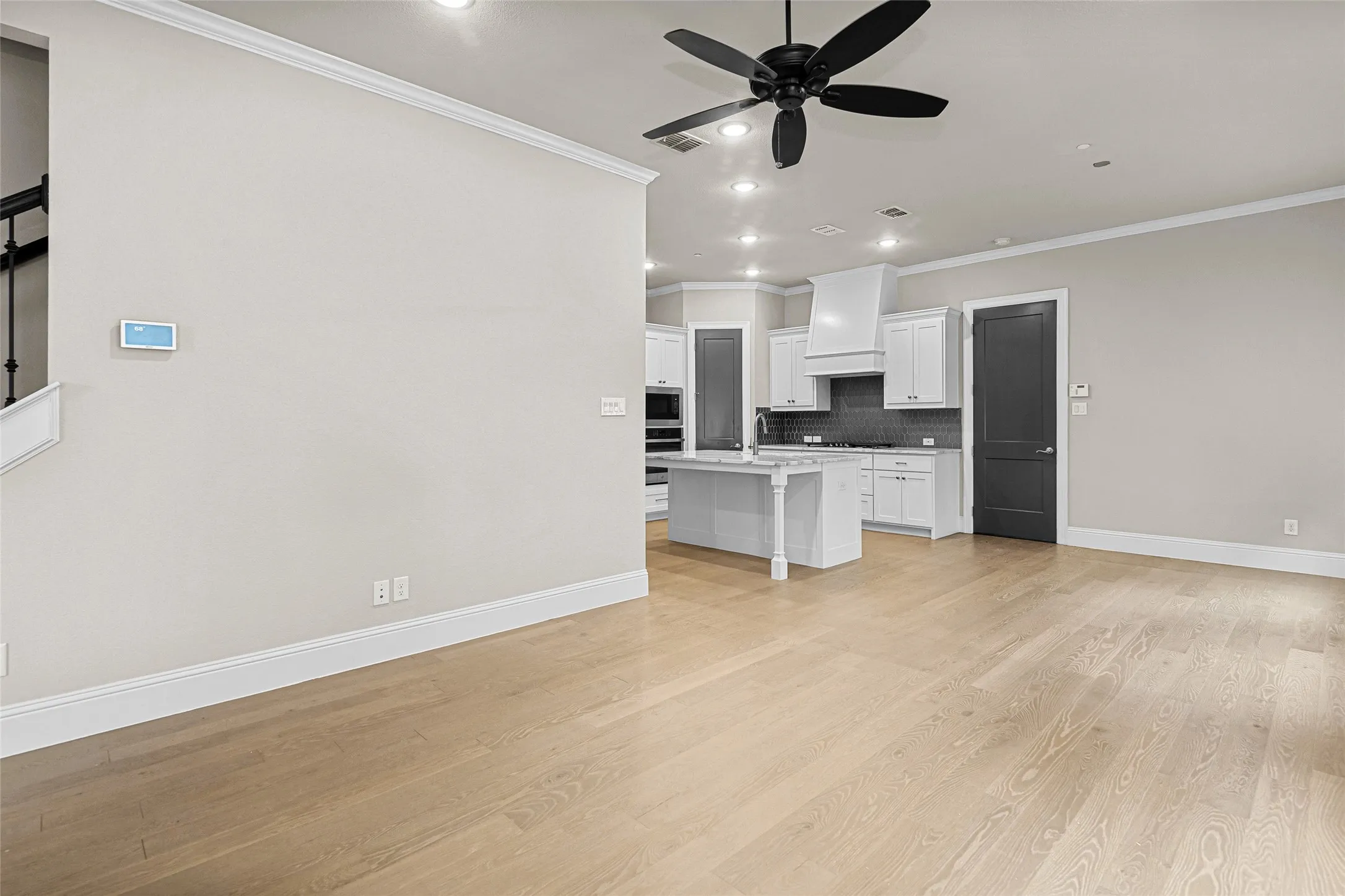 Living room connects to dining room and kitchen.  Open concept space
