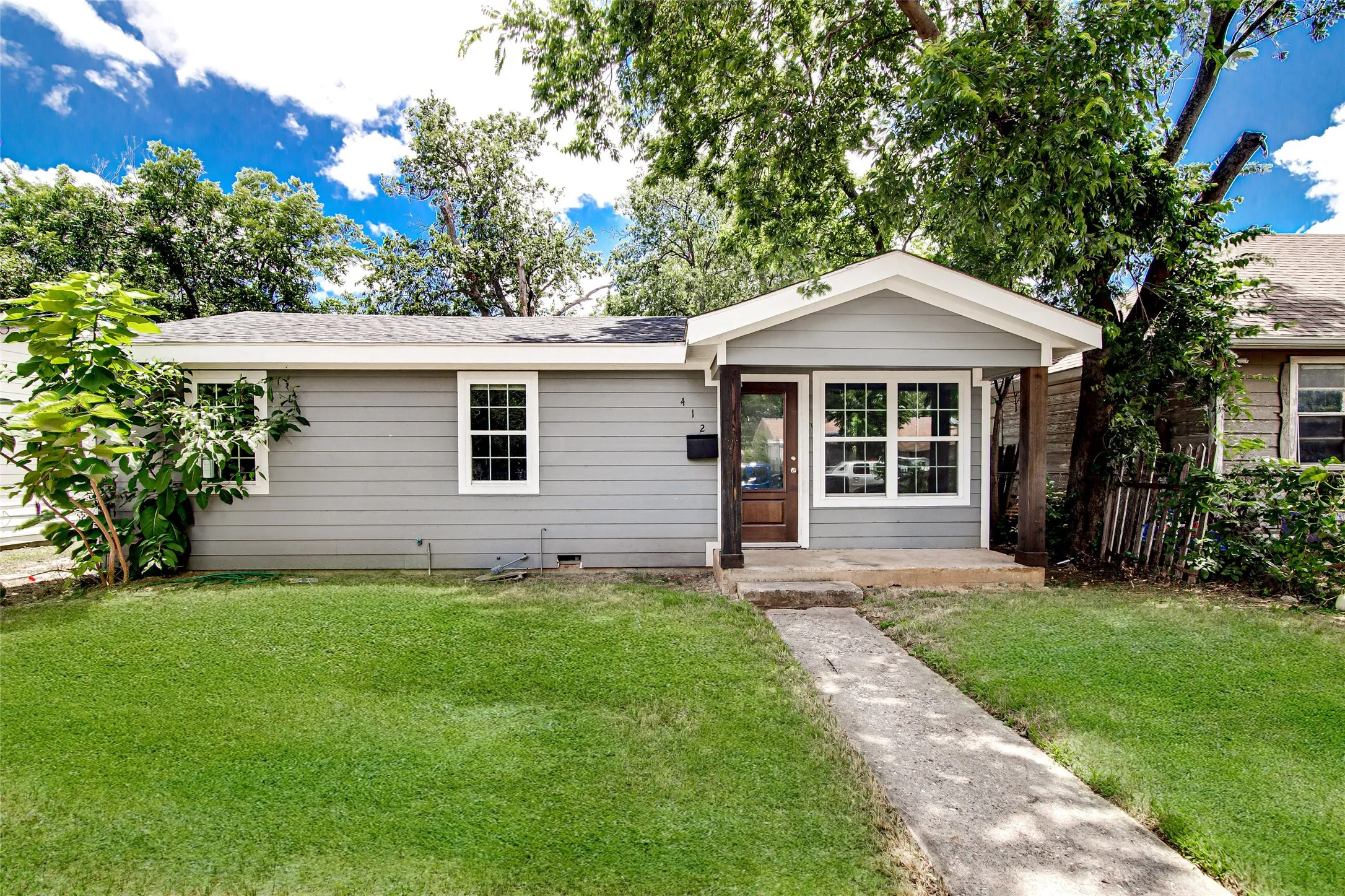 Gray siding exterior with white trim