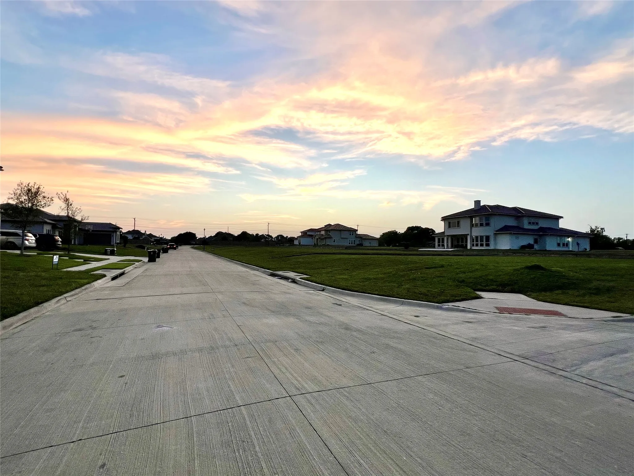 View of concrete street with curbs