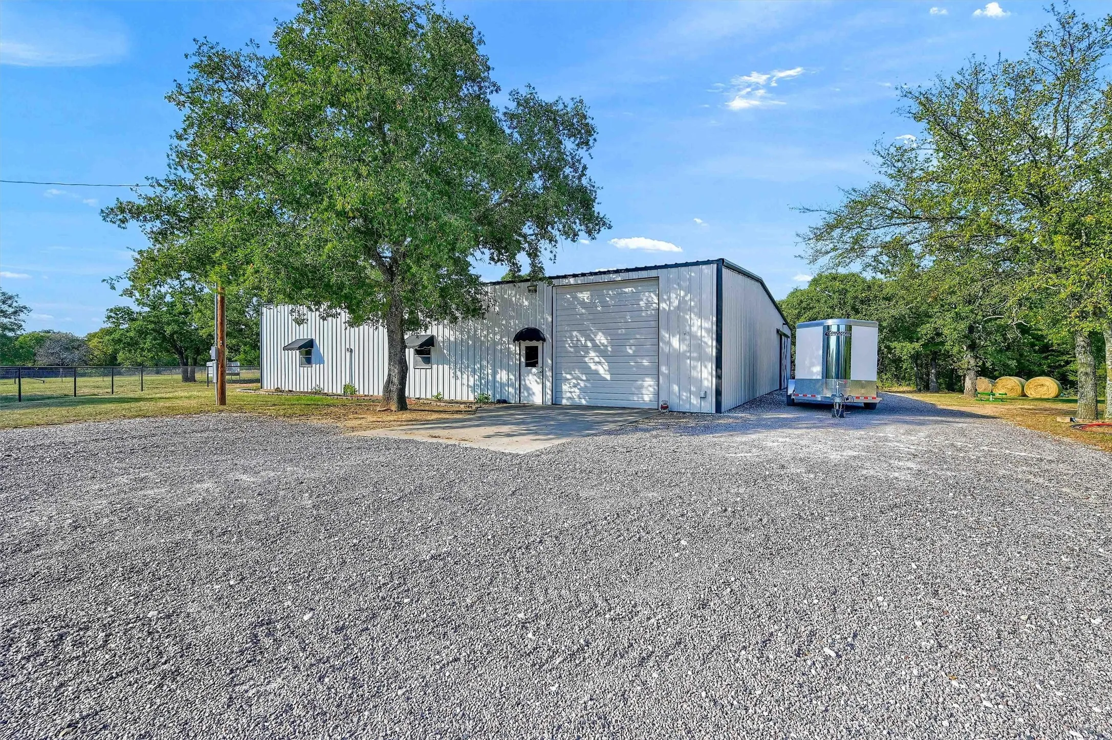 The shop-barn is separate yet convenient to the home, with lots of parking and turn-around space.