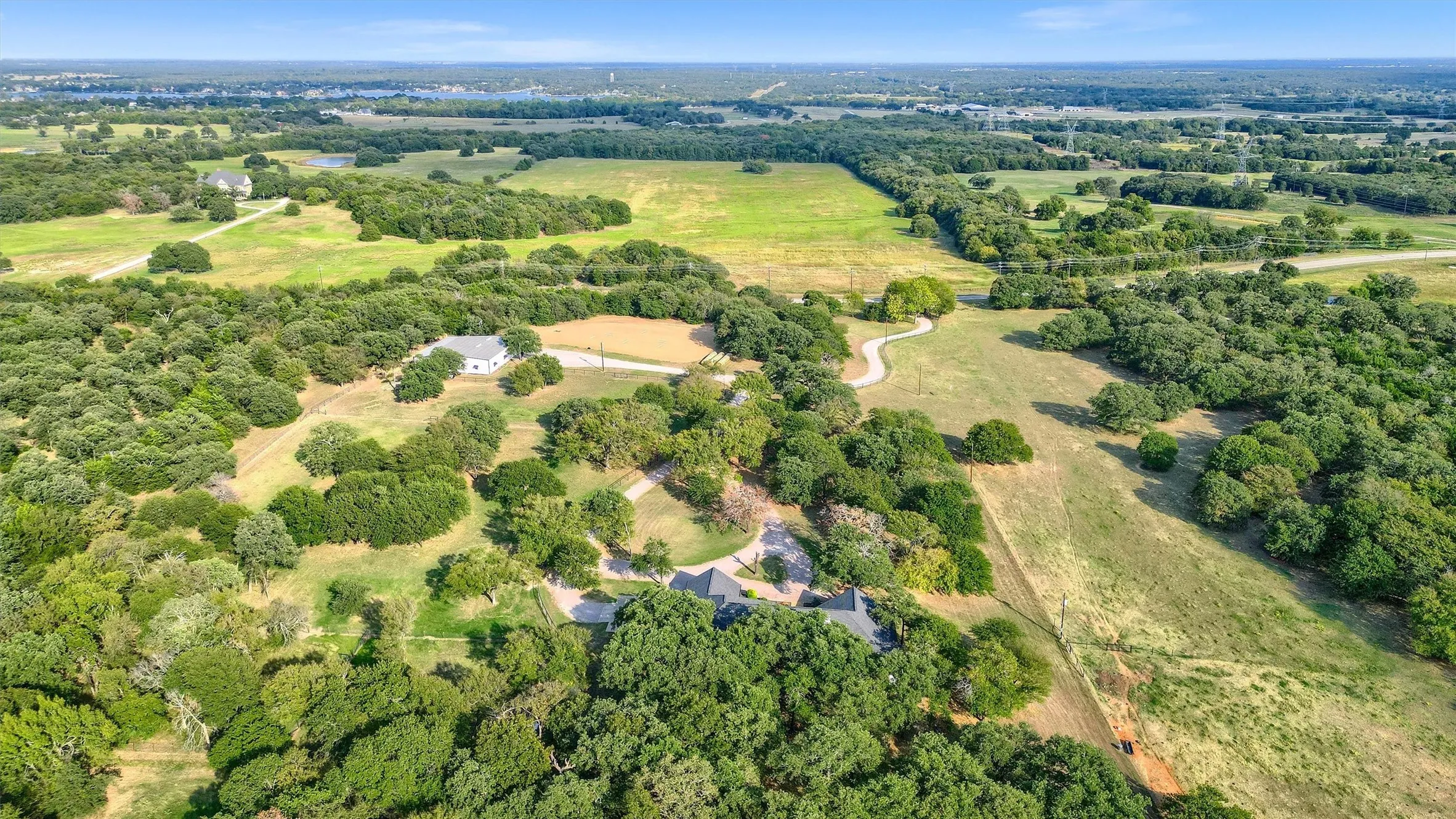 Aerial view showing the location of the home relative to the shop and entrance off FM 3496.