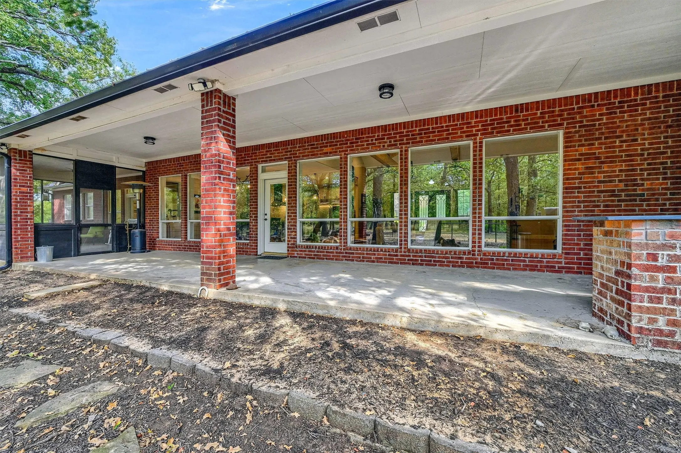 The large covered back patio further extends the living and entertaining areas.