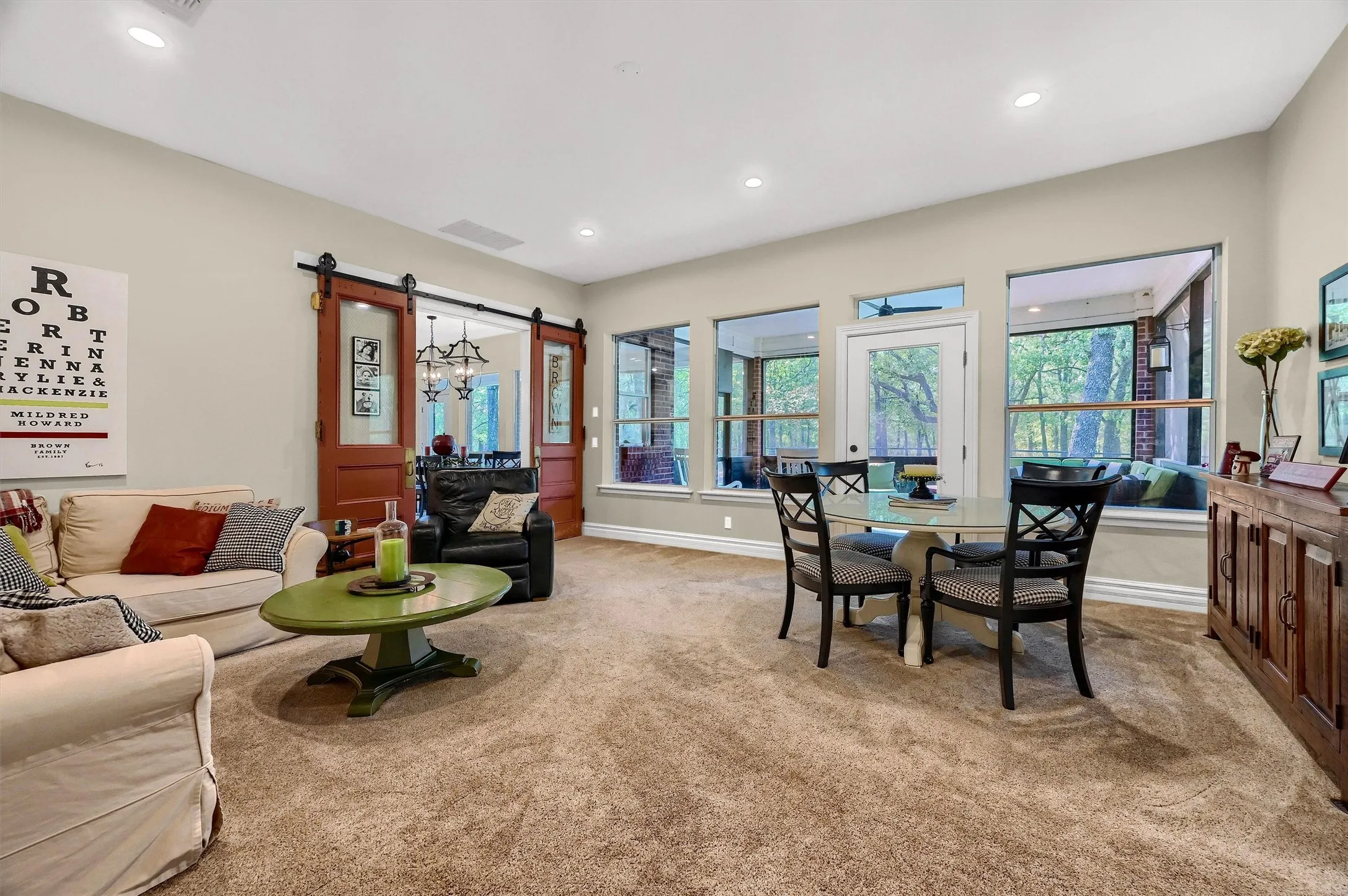 Additional living area off the dining room - accessible through custom barn doors.