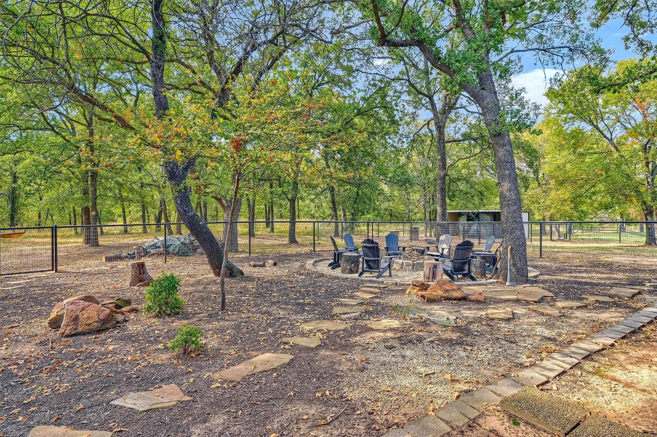 The firepit in the backyard is great for enjoying Texas evenings with family and friends.