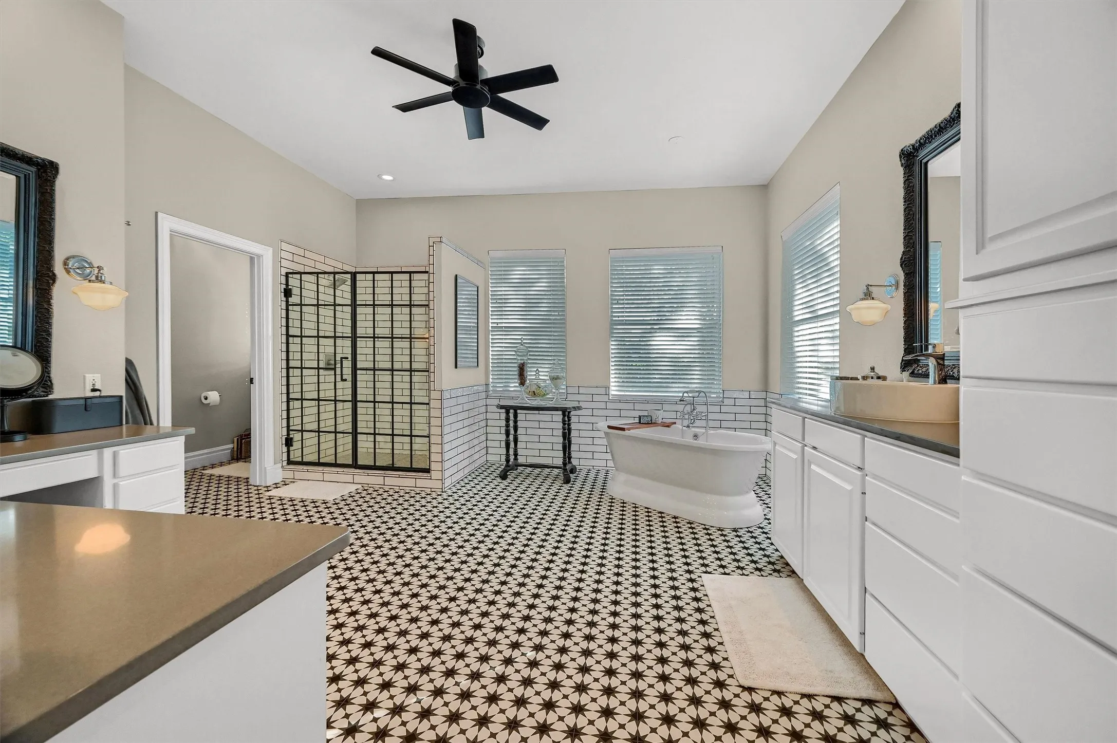 Primary ensuite bathroom has a stand-alone soaking tub, a large shower and dual vanities.