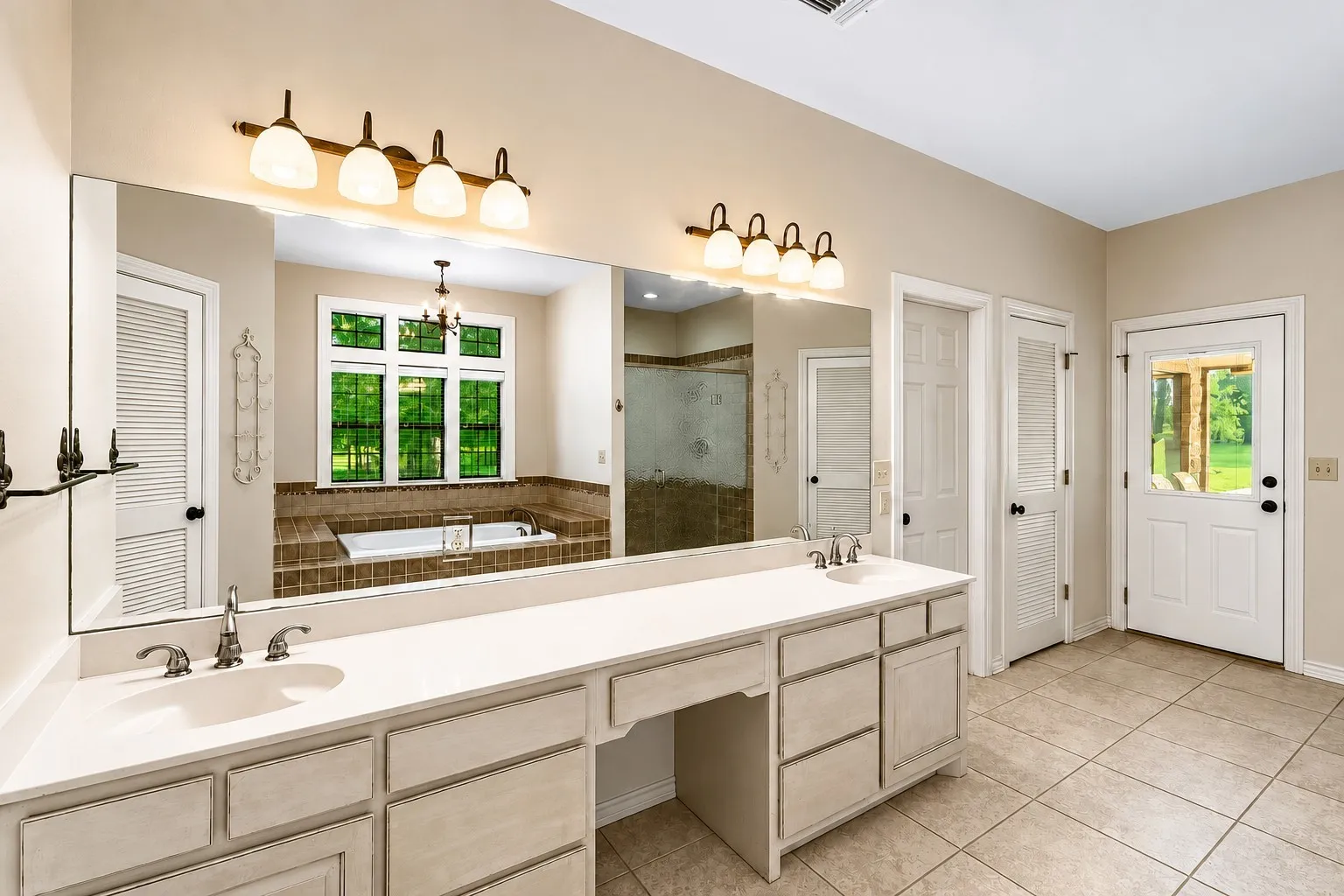Notice the Garden Tub windows have a view of the beautiful outdoor trees!  One of the doors leads to the backyard porch.