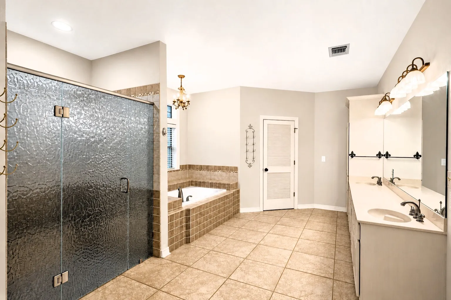 Primary Bathroom includes Garden Tub, Huge Shower with Double Shower Heads!  In addition, access to two Walk-in Closets!
