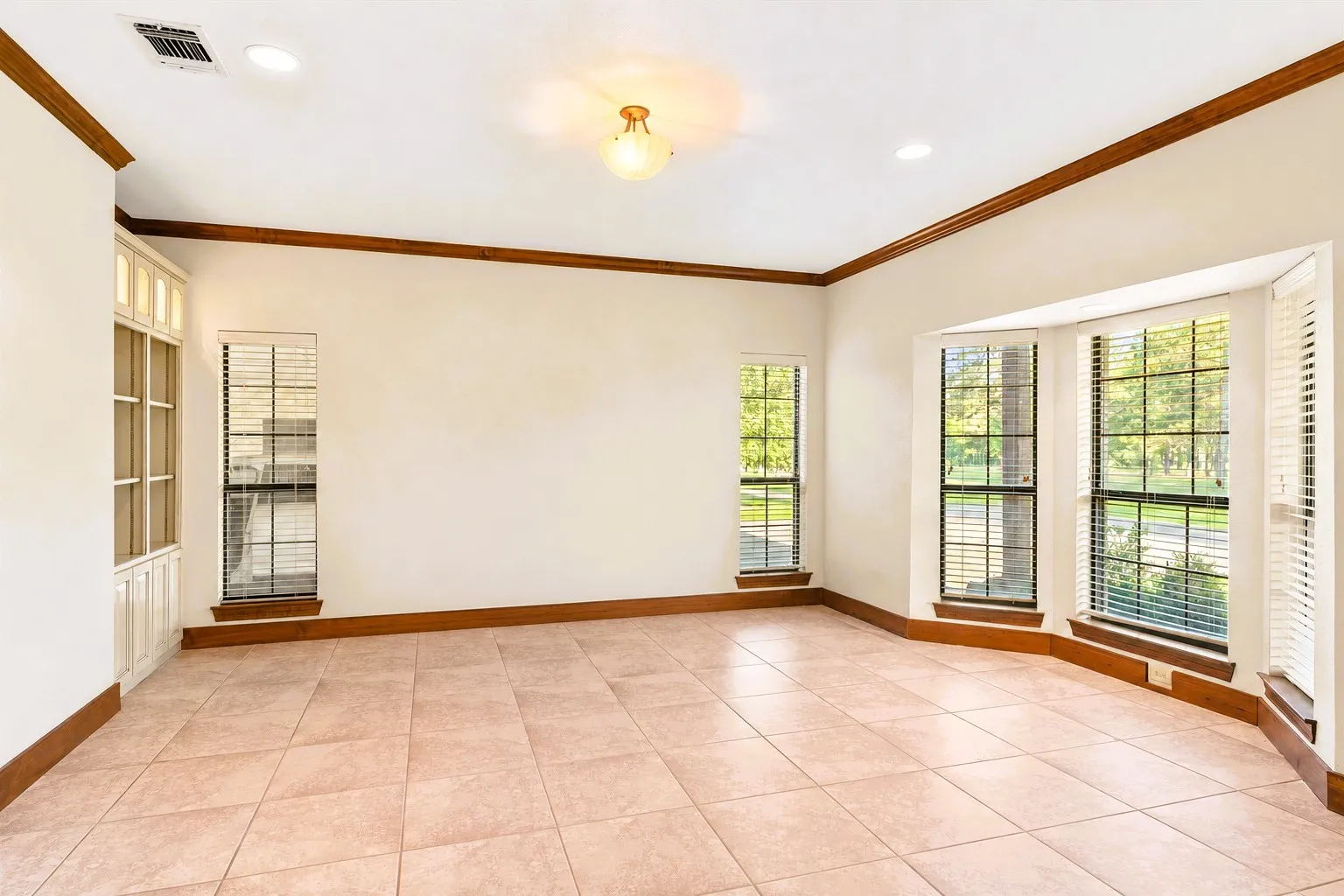 Imagine this formal living room setting with a large couch, piano, coffee tables & chairs!