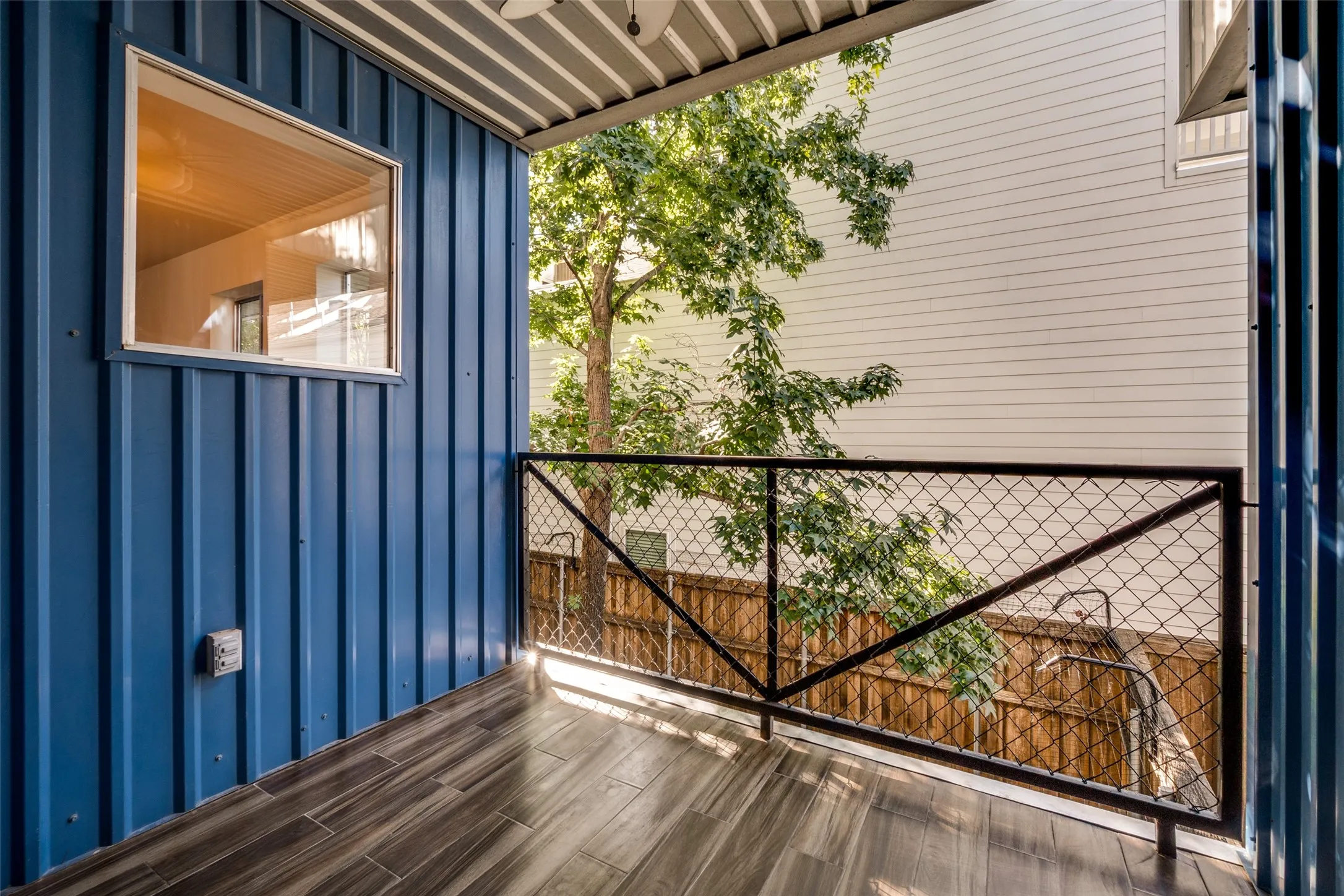 Balcony off of dining area overlooks back patio and courtyard.