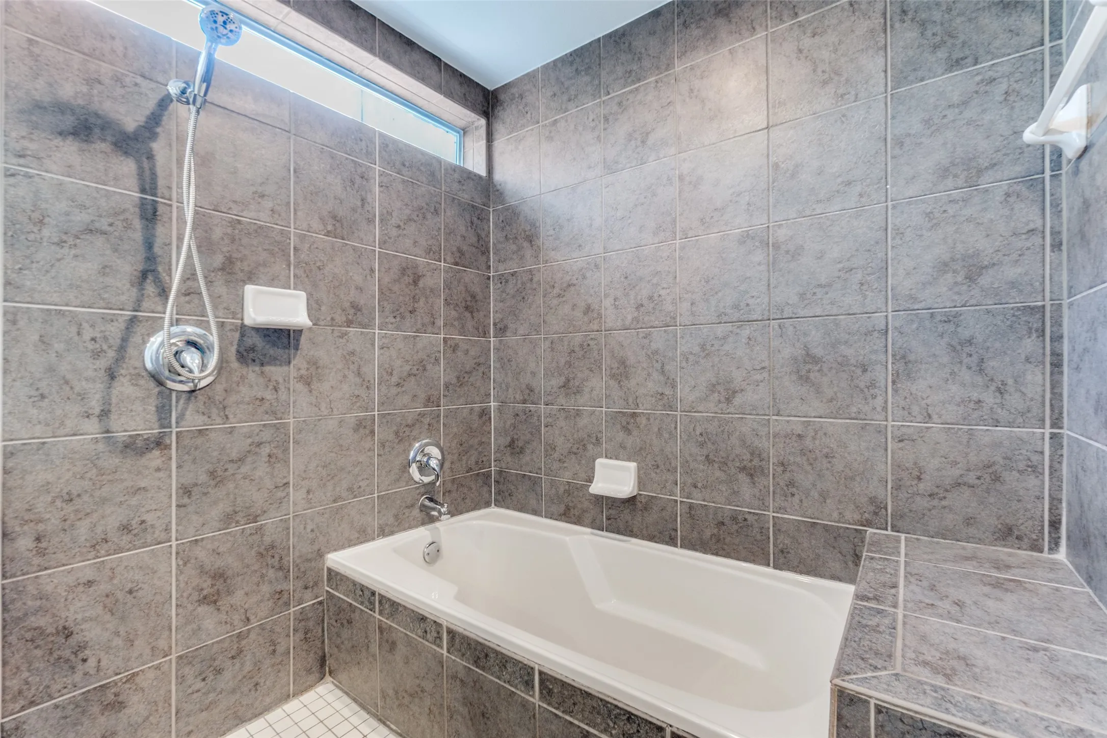 Soaking tub and shower in wet room.