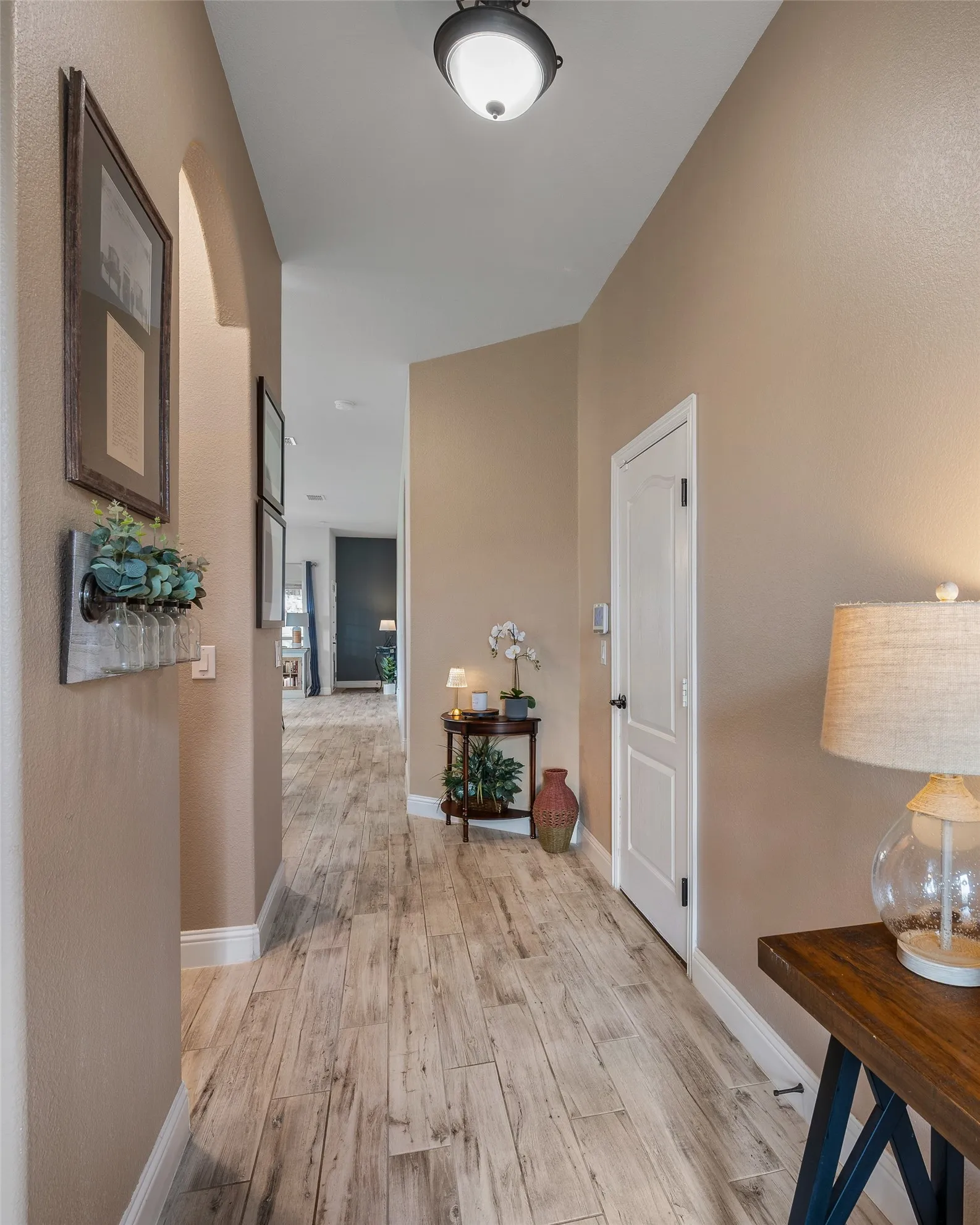 Leads to open kitchen and living areas