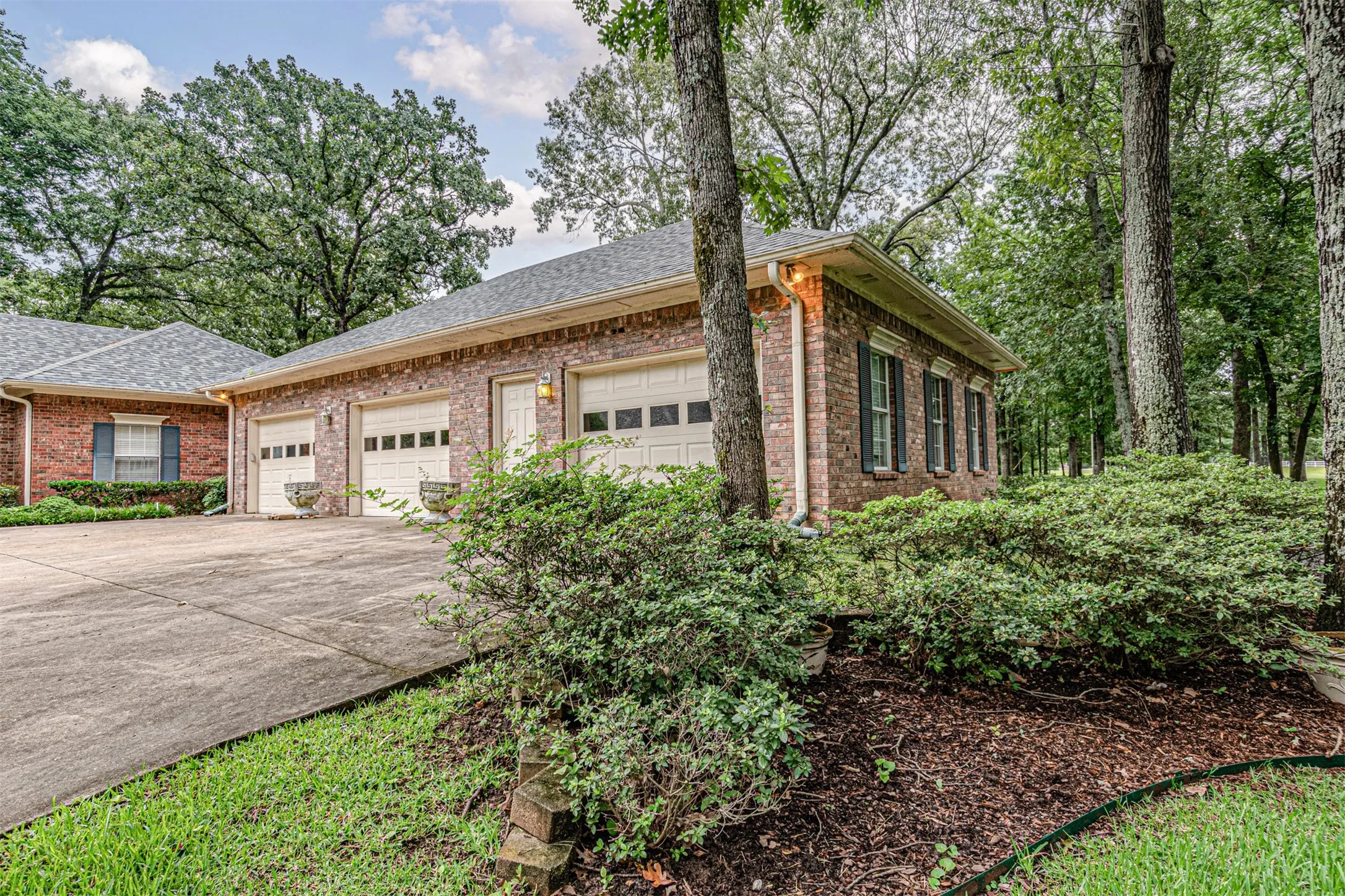 Large detached garages featuring fully decked attic space with traditional stairs
