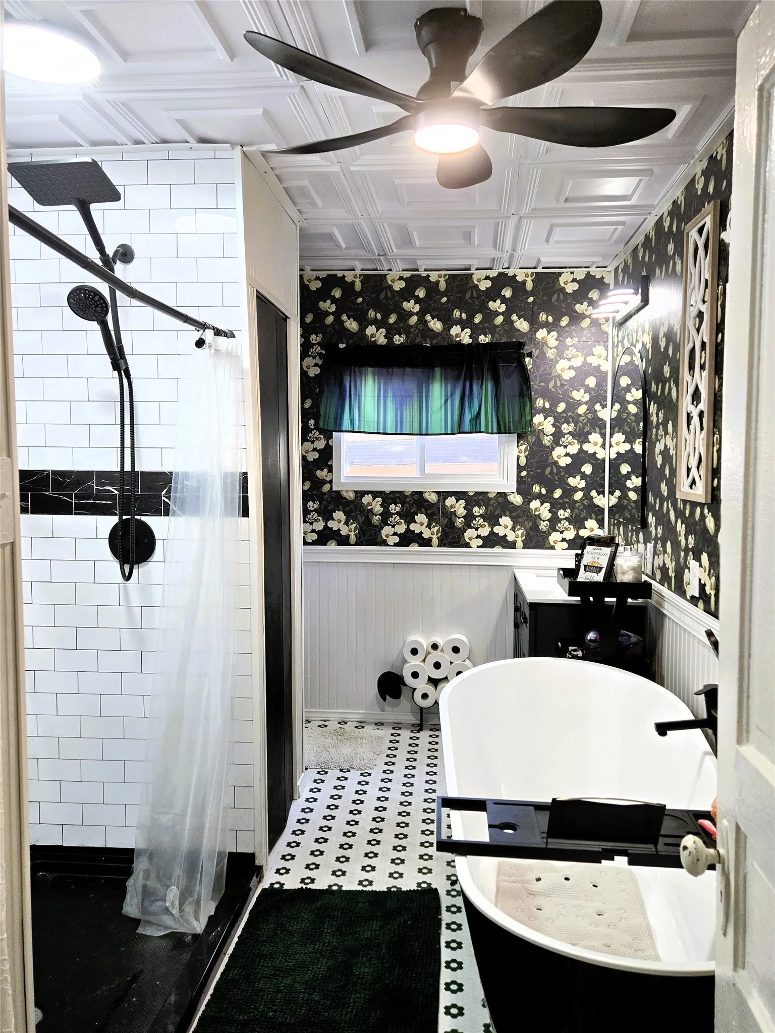 Full size bathroom with separate tub and separate shower on first level.