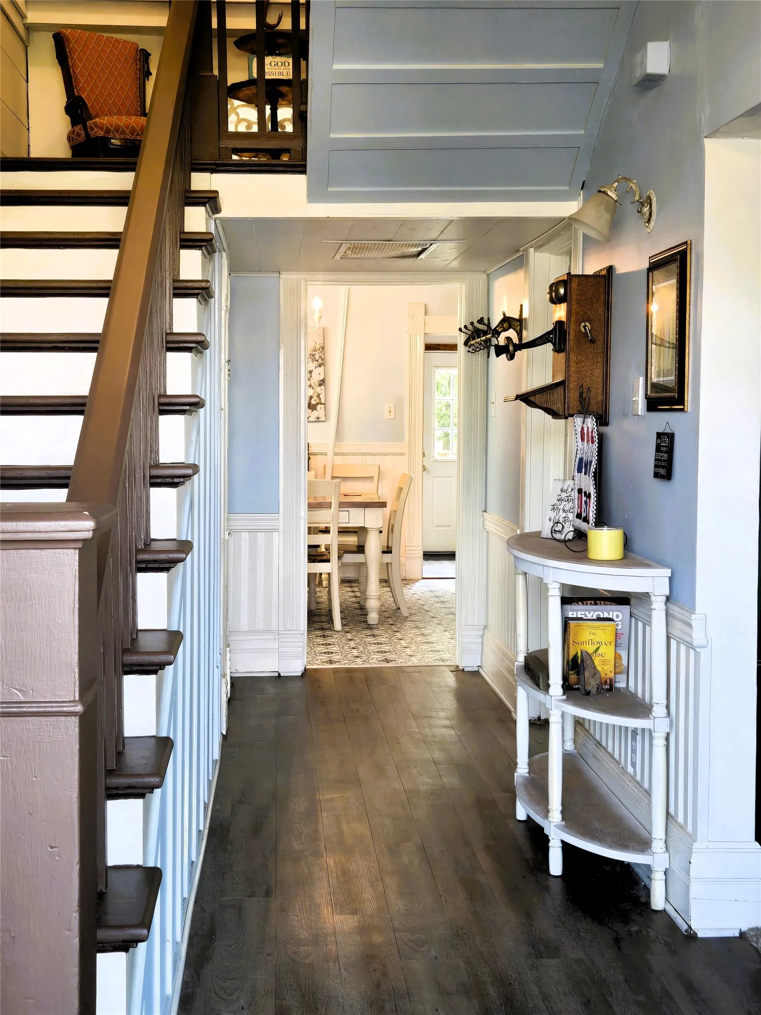 Entry with stair way and primary bedroom to the left. Living room to the right with kitchen towards the back.