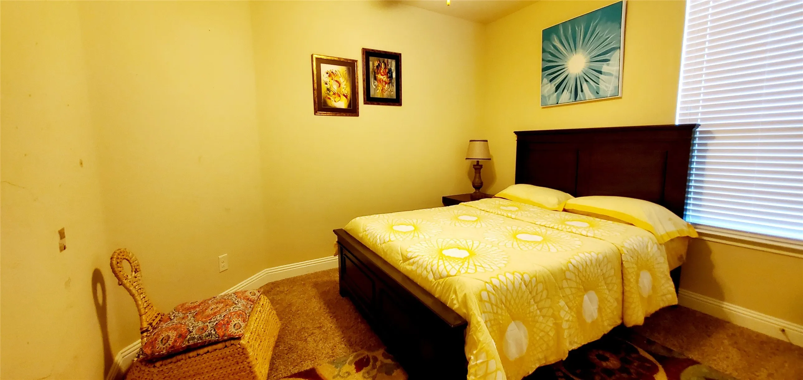 Carpeted room featuring light-toned walls and crown molding