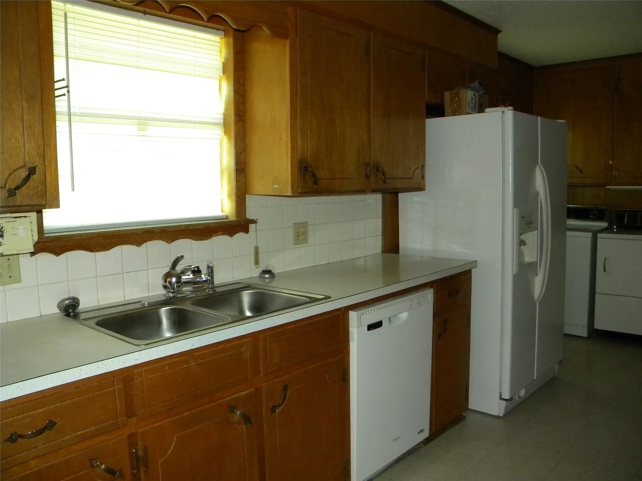 Sink (water filter attached). dishwasher and Refrigerator
