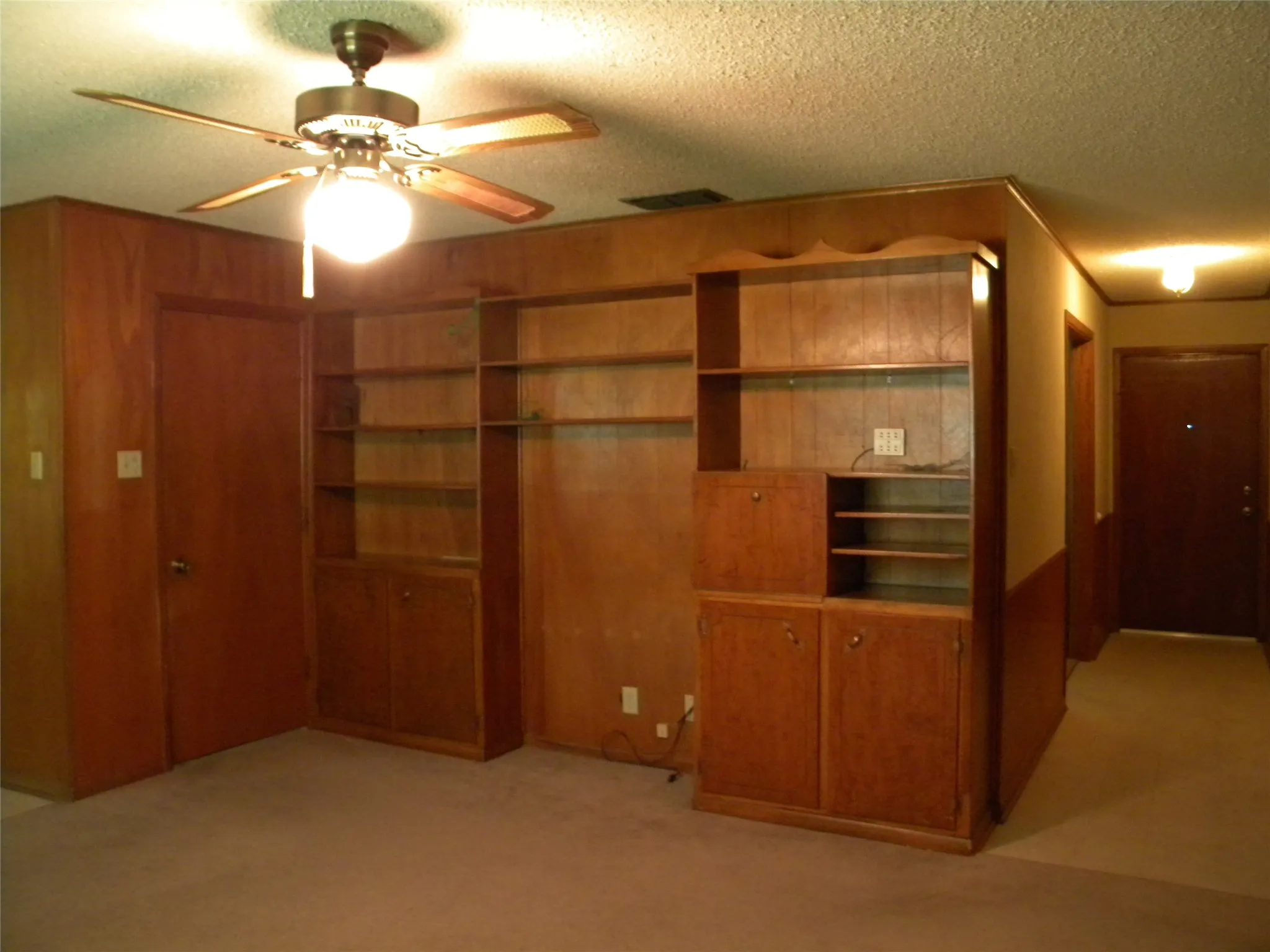 Built-In Shelving, Storage and Media/Electronic Equipment, Books and Memorabilia. And, entry to Garage.