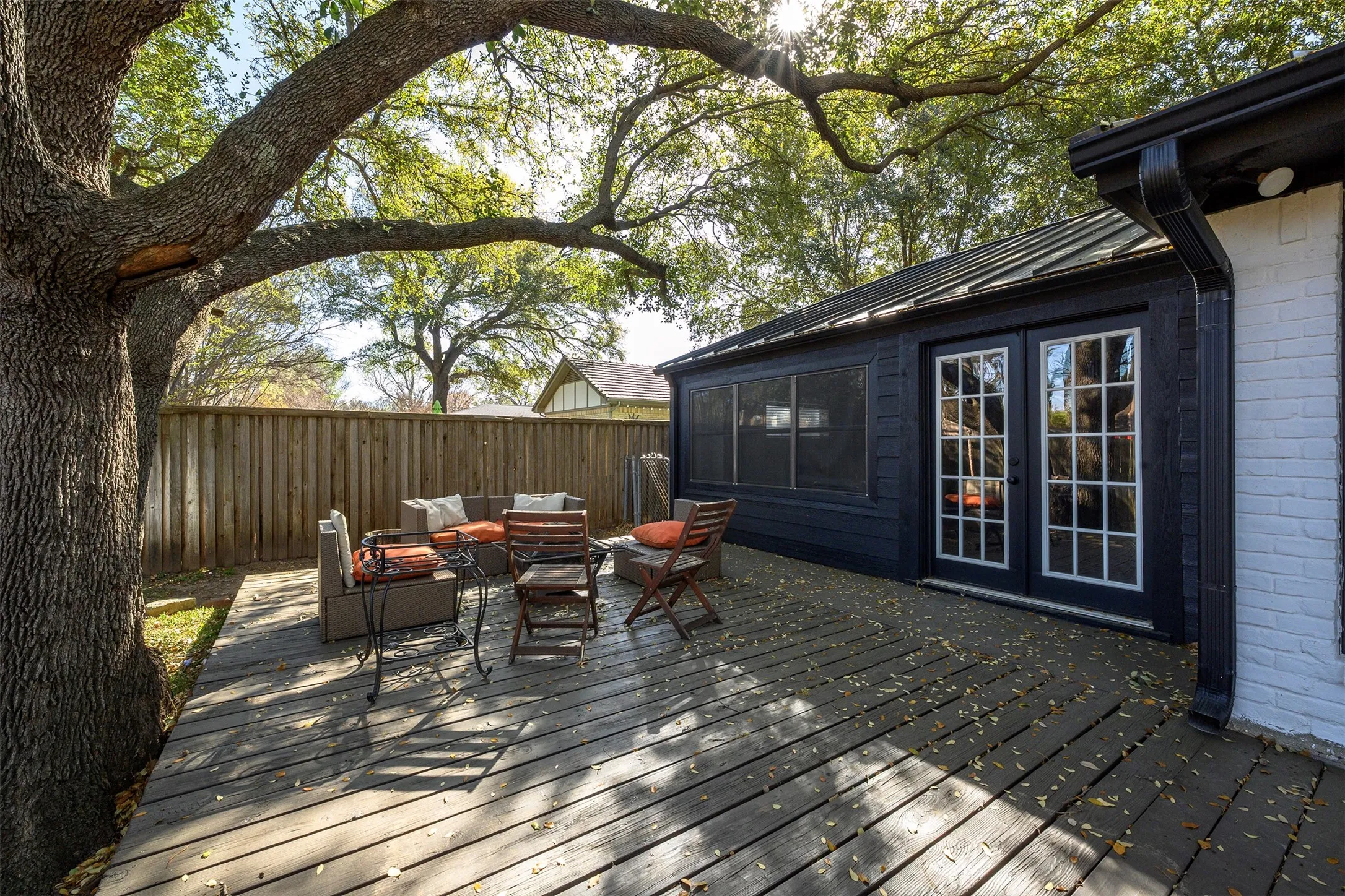 Expansive wood-finish deck with a privacy fence