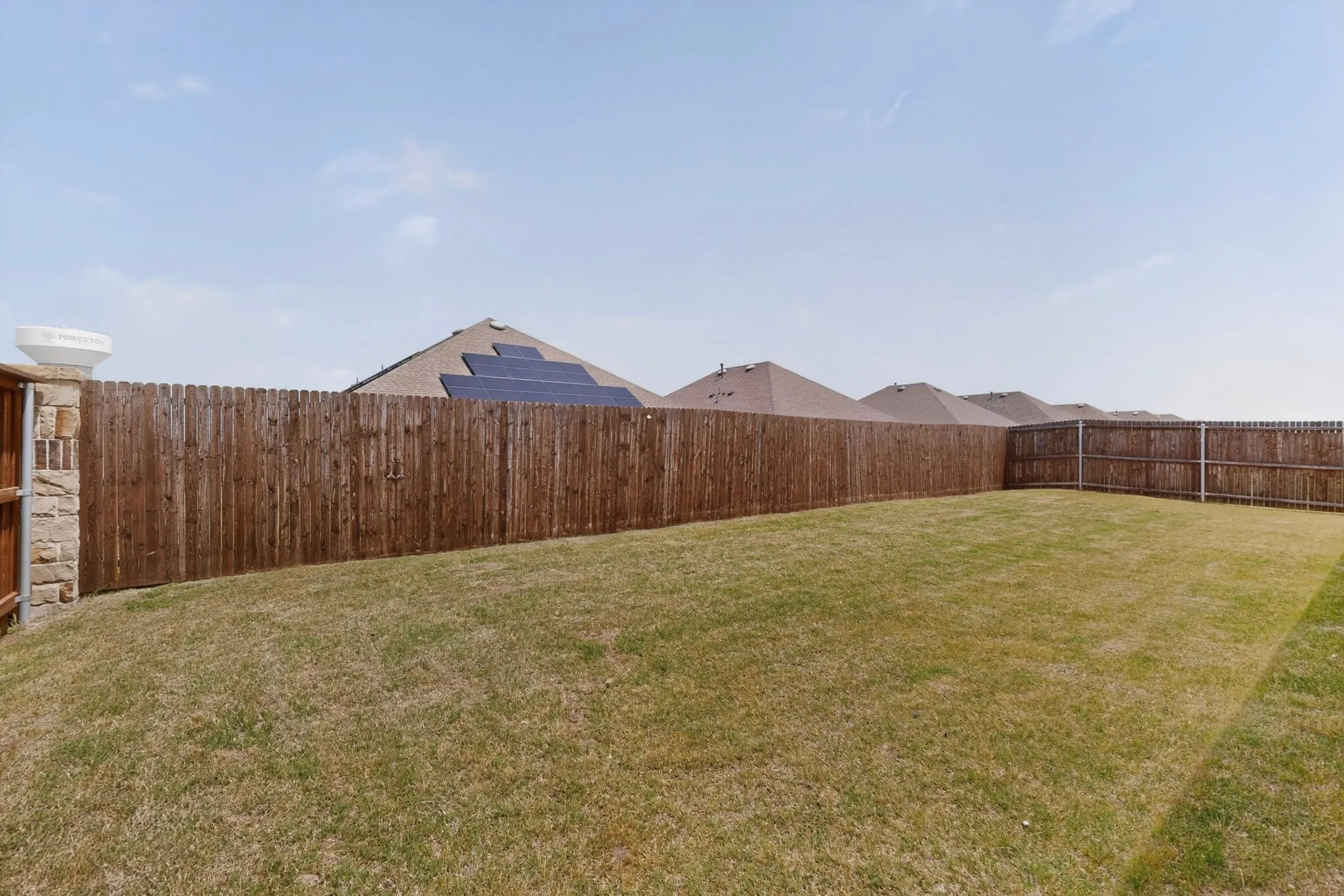 flat spacious backyard for kids or pets to run around.