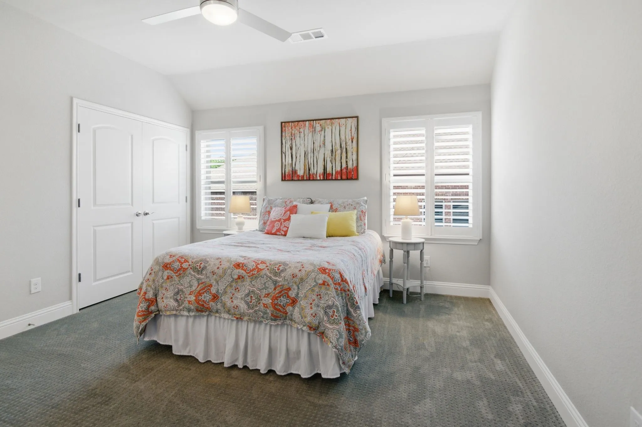 Bedroom featuring neutral-toned walls and plush gray carpeting
