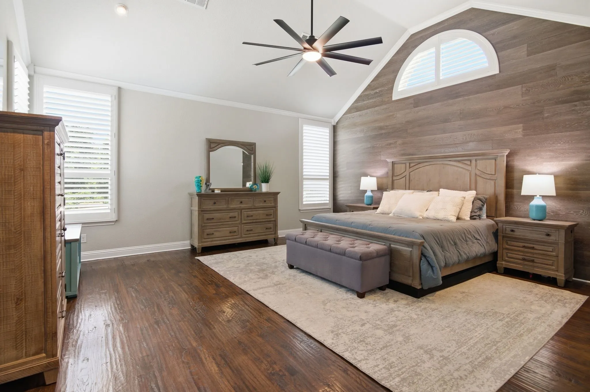 Vaulted ceiling with a contemporary ceiling fan and light fixture