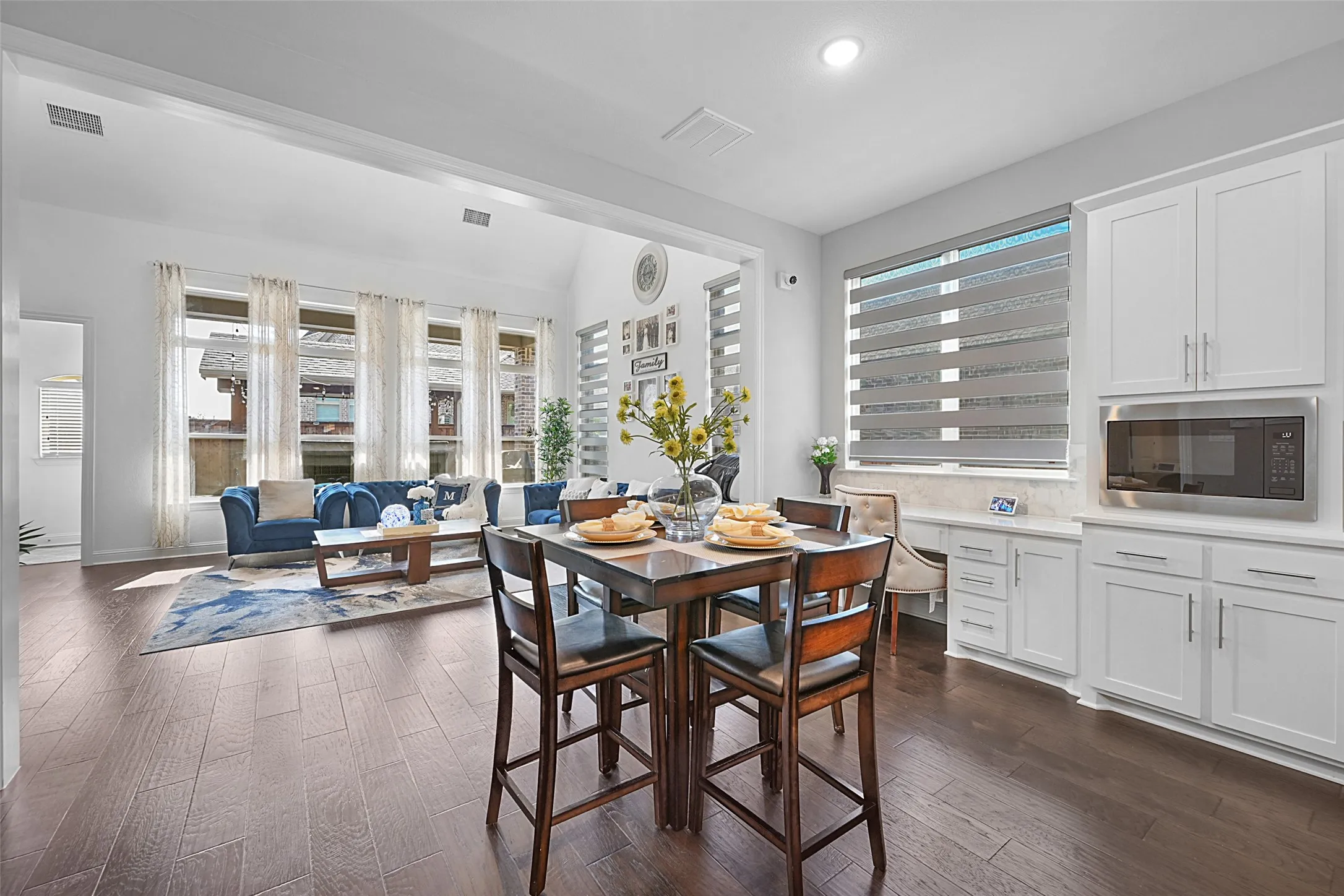 Open-concept living area with wood-finish flooring