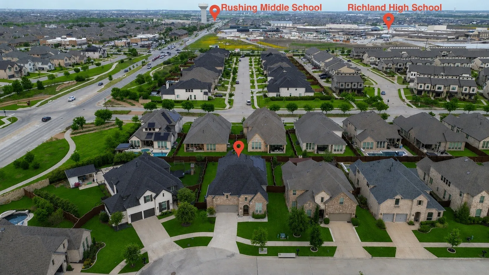 Aerial perspective of a developed residential area with multiple single-family homes