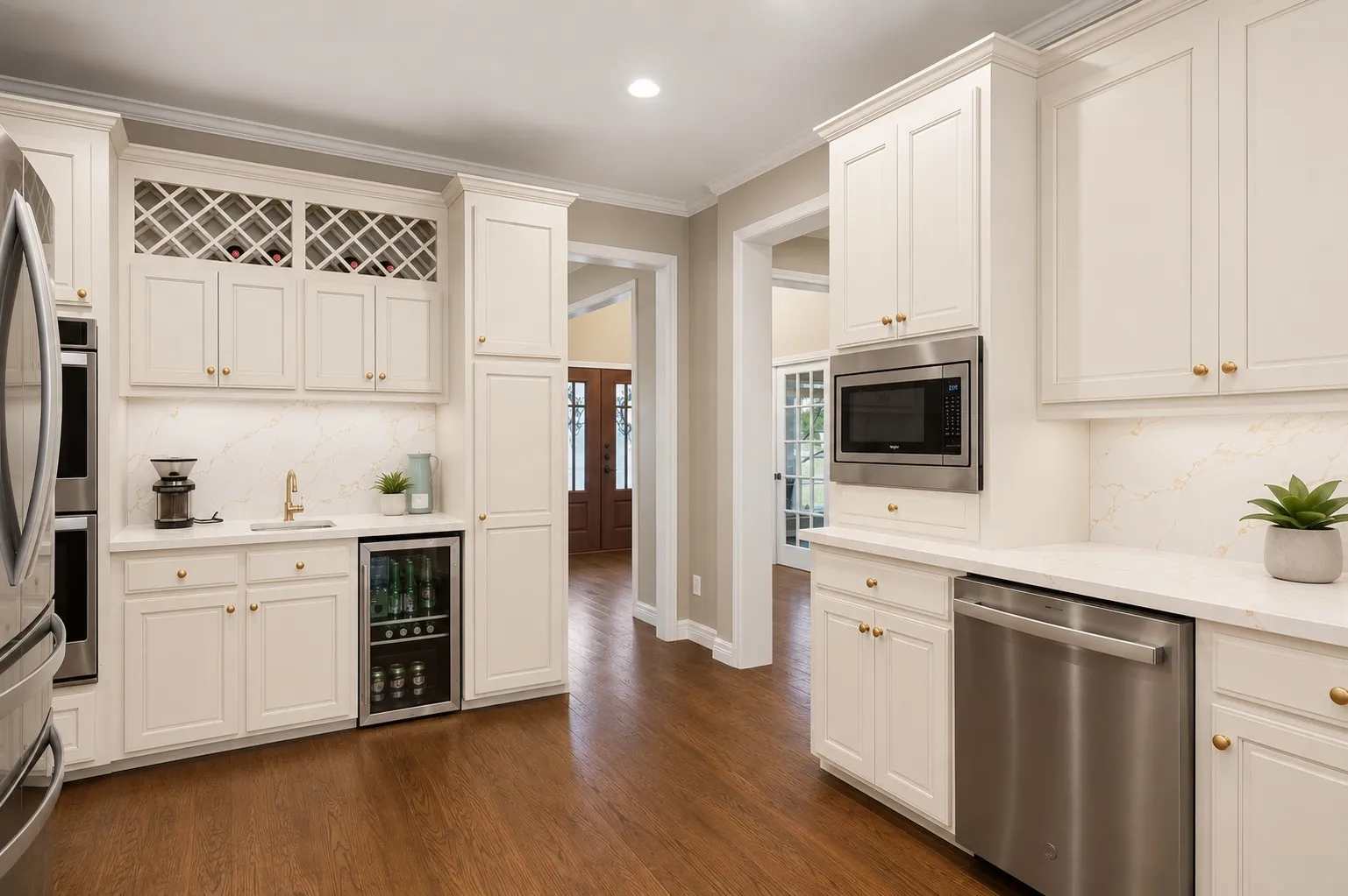 Update to kitchen includes painting cabinets, adding quartz to counters and backsplash, new hardware and sink.