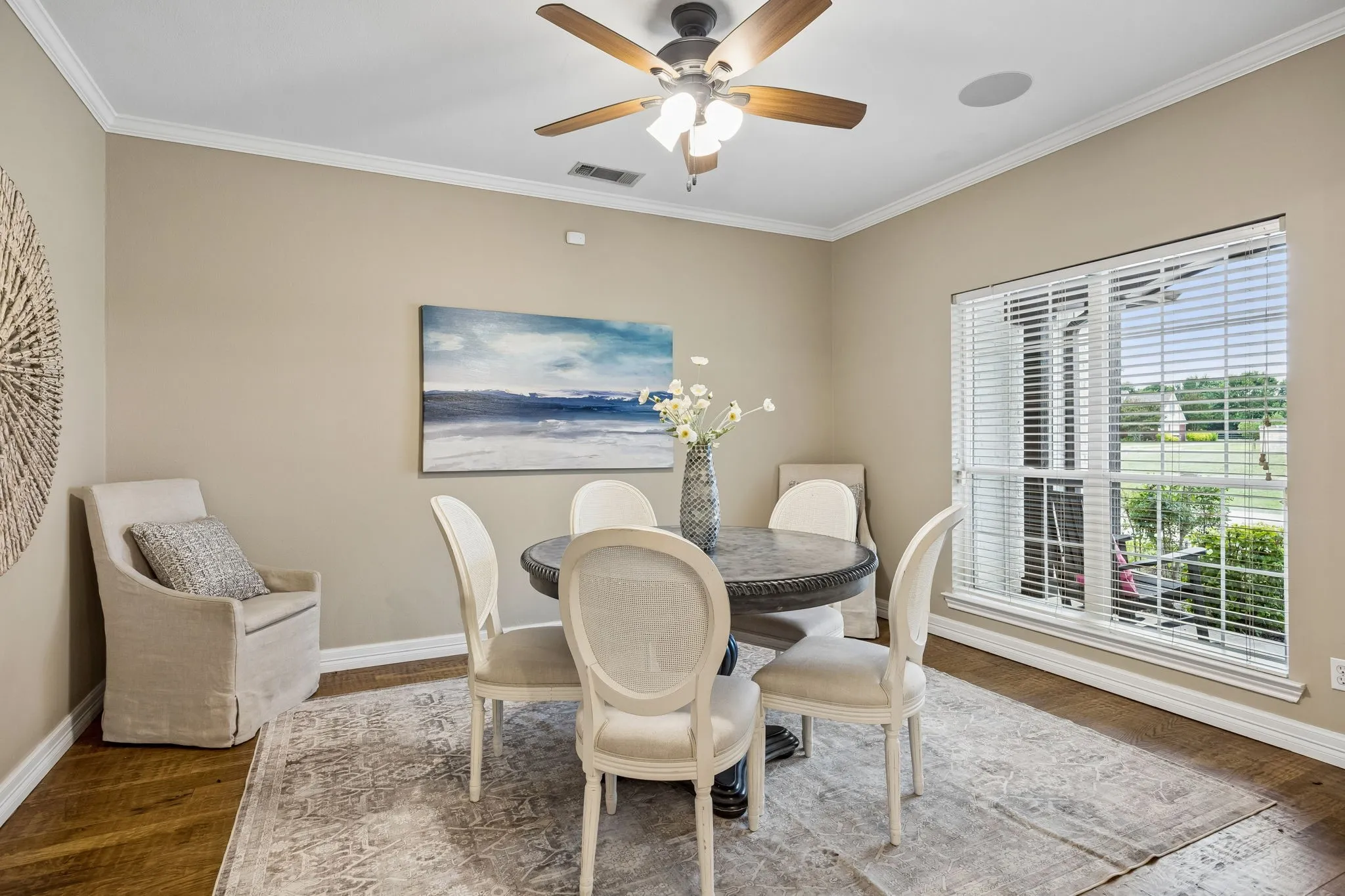 Formal dining with beautiful wood floors and great natural light.