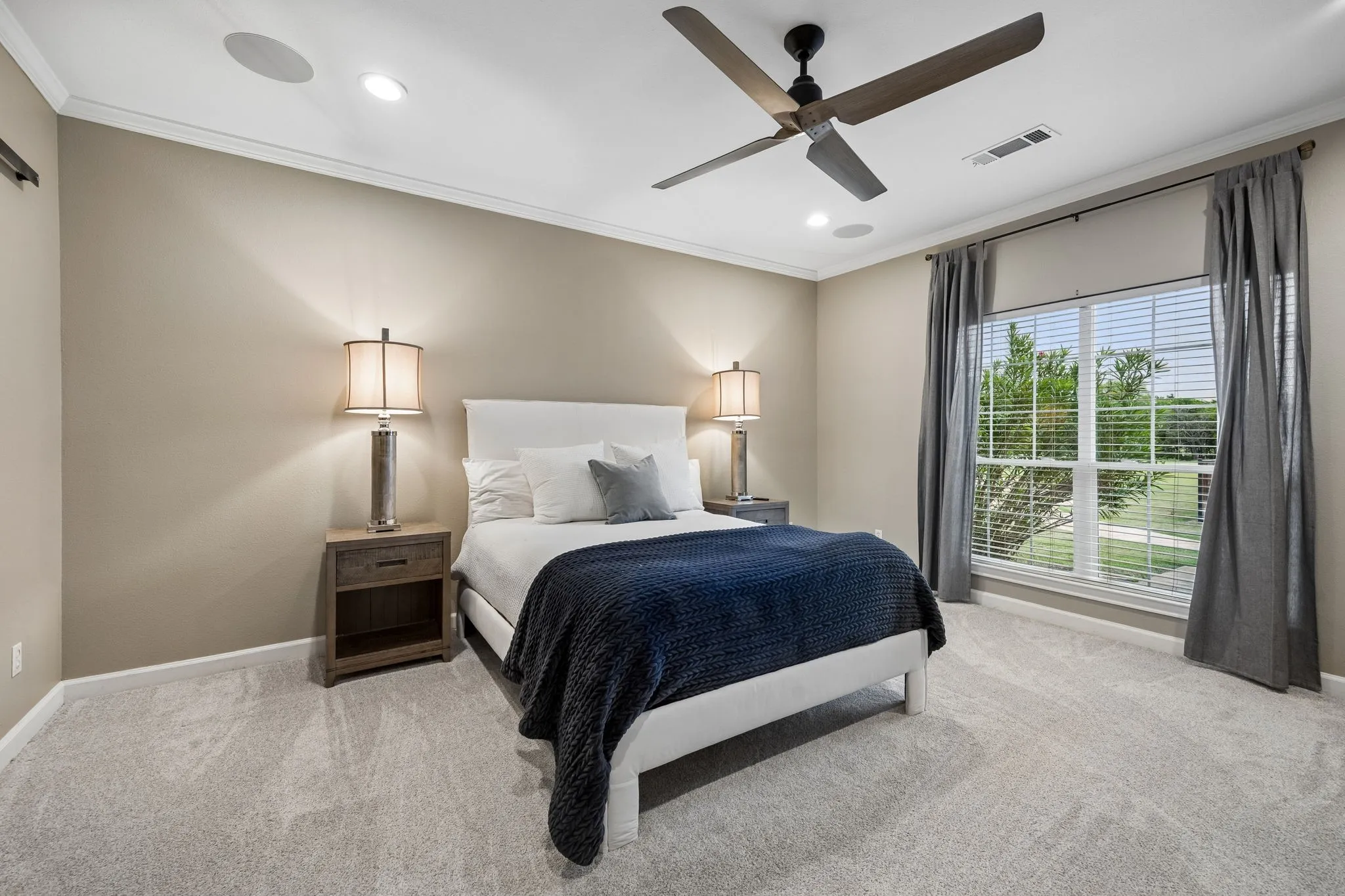The primary bedroom is separate from all other bedrooms and overlooks the pool and acreage.