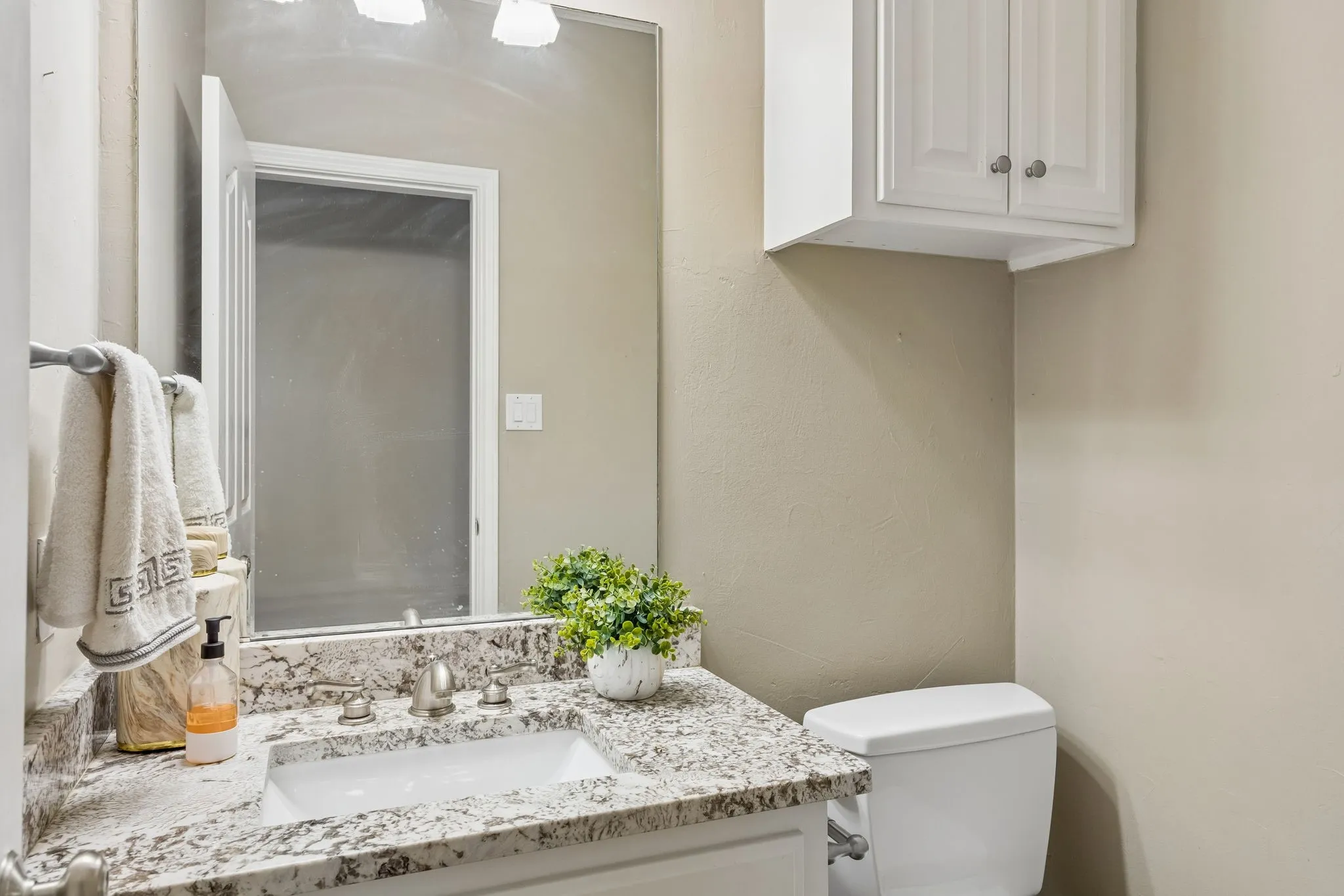 Dedicated guest bathroom, neutral and clean.
