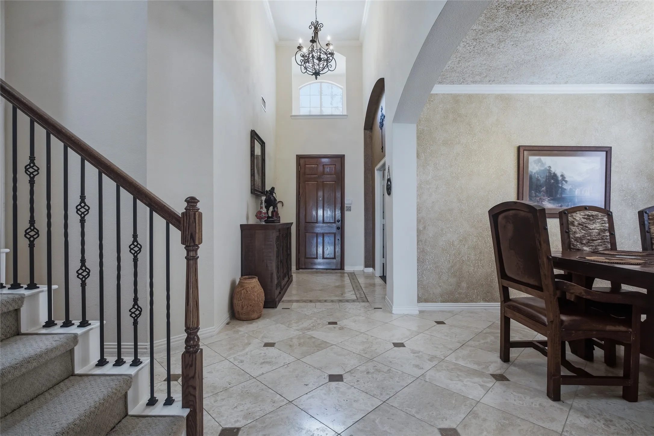 Entryway featuring travertine