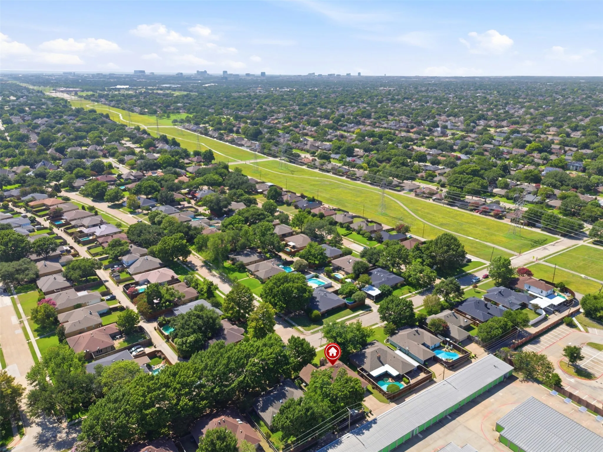 Aerial overview showcasing a residential neighborhood with numerous mature trees