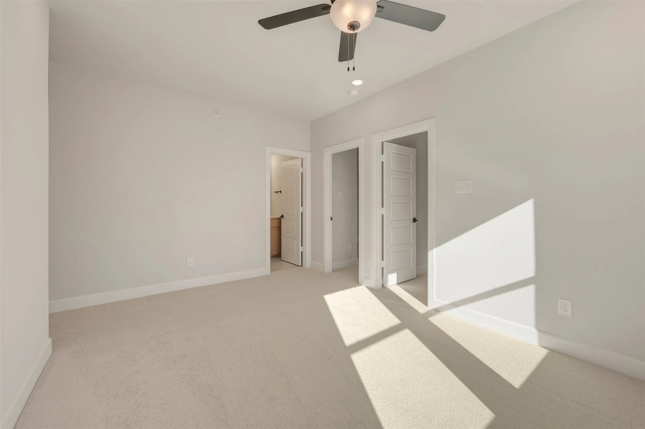 Neutral-toned wall paint with plush carpeting