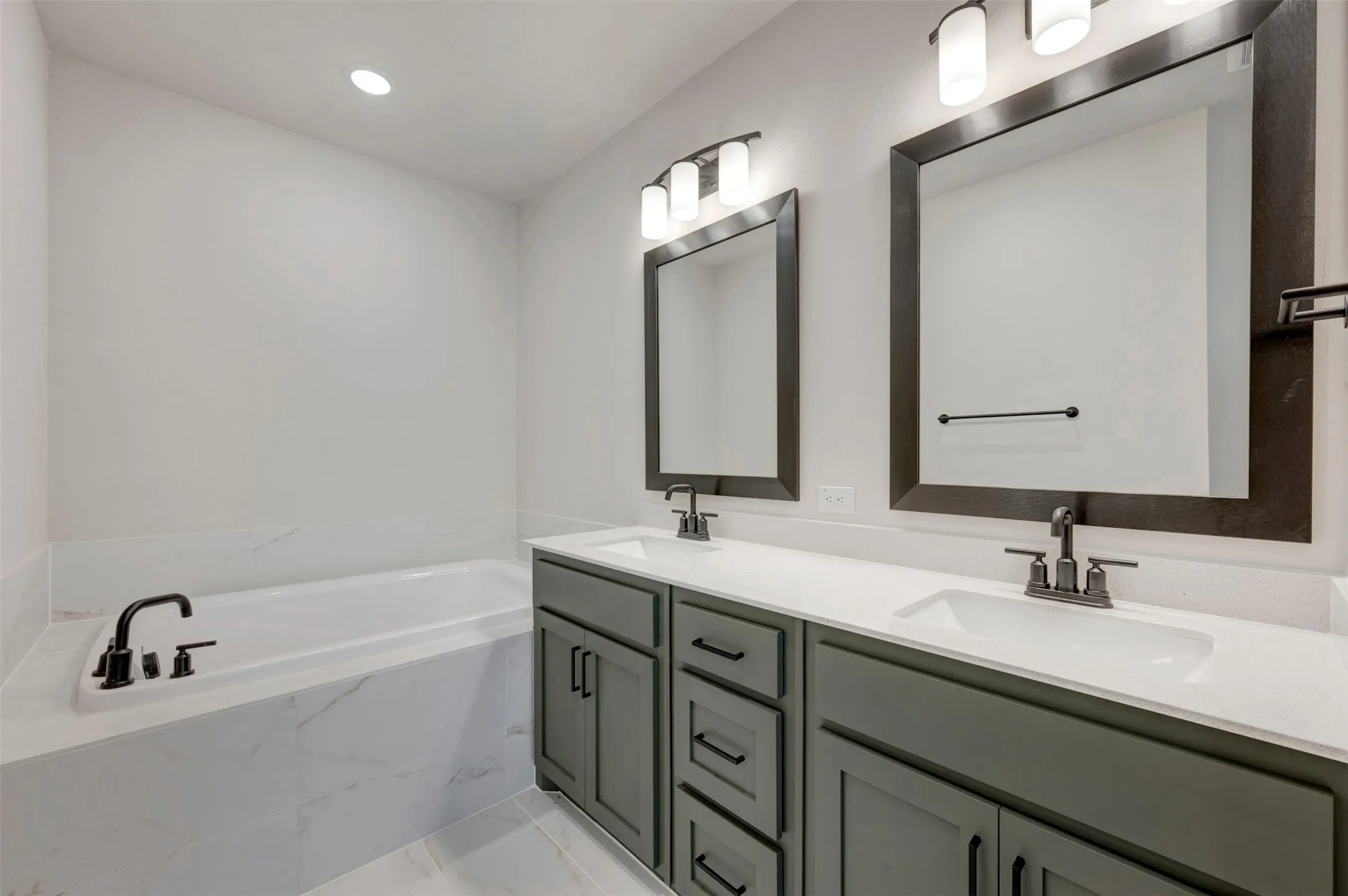 Dual vanity with shaker-style cabinetry and integrated sinks