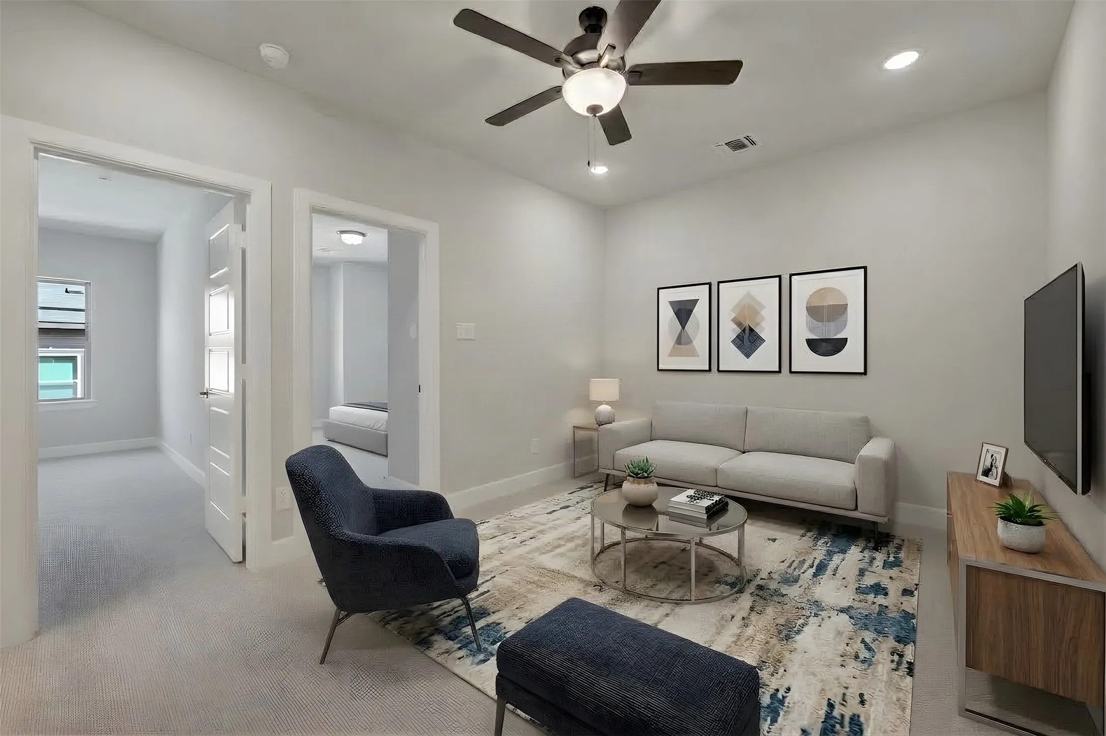 Recessed lighting, ceiling fan with light fixture, light-toned wall paint, and white trim