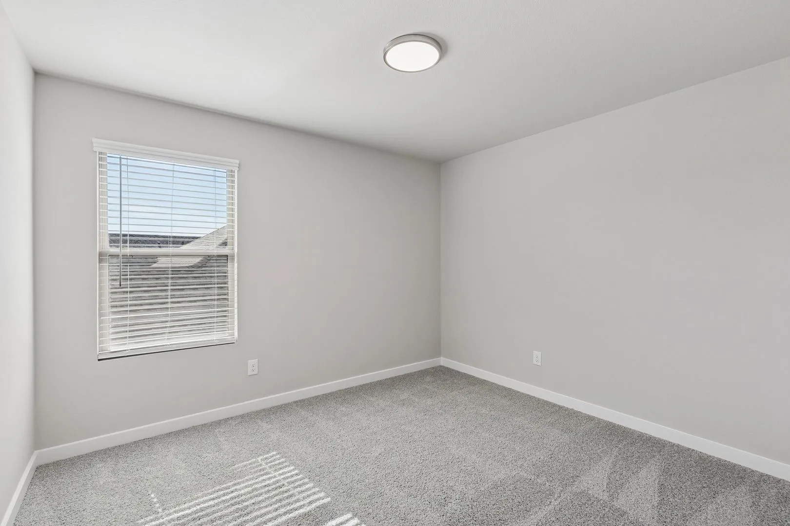 Bedroom in the Holden home plan by Trophy Signature Homes – REPRESENTATIVE PHOTO