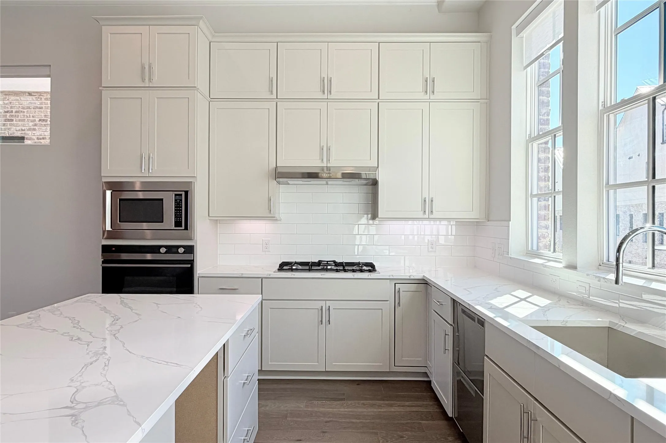 Progress photo of actual unit. Island features opening for wine or beverage fridge.