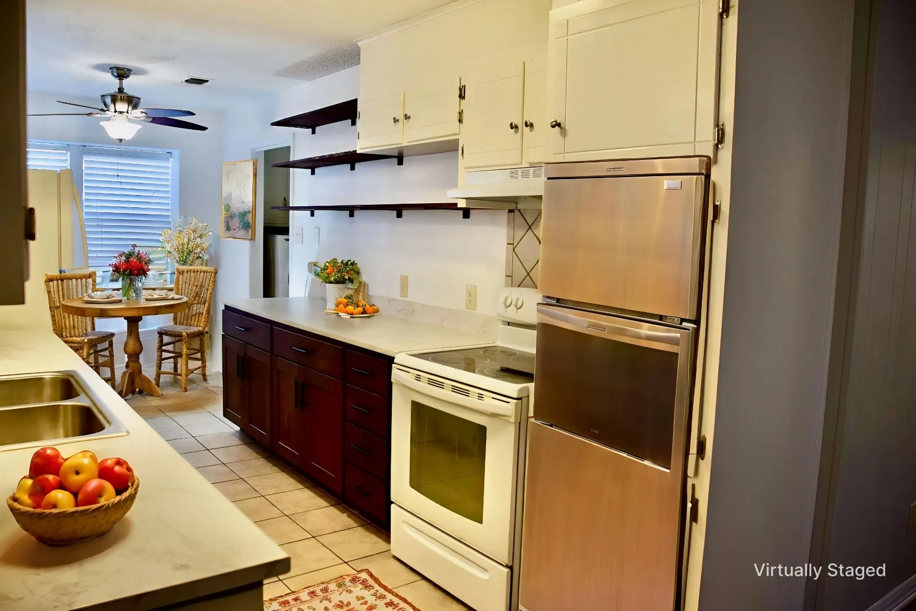 Kitchen featuring light countertops, wood-finish lower cabinetry, white upper cabinets, stainless steel double ovens, and open shelving