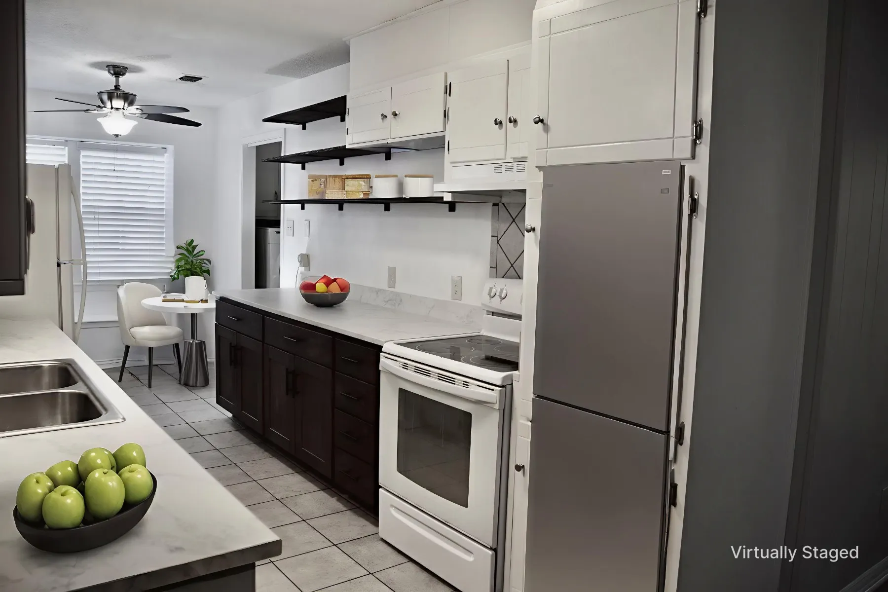 Kitchen featuring white upper cabinetry, dark wood-finish lower cabinetry, light-toned countertops, tile flooring, and stainless steel appliances