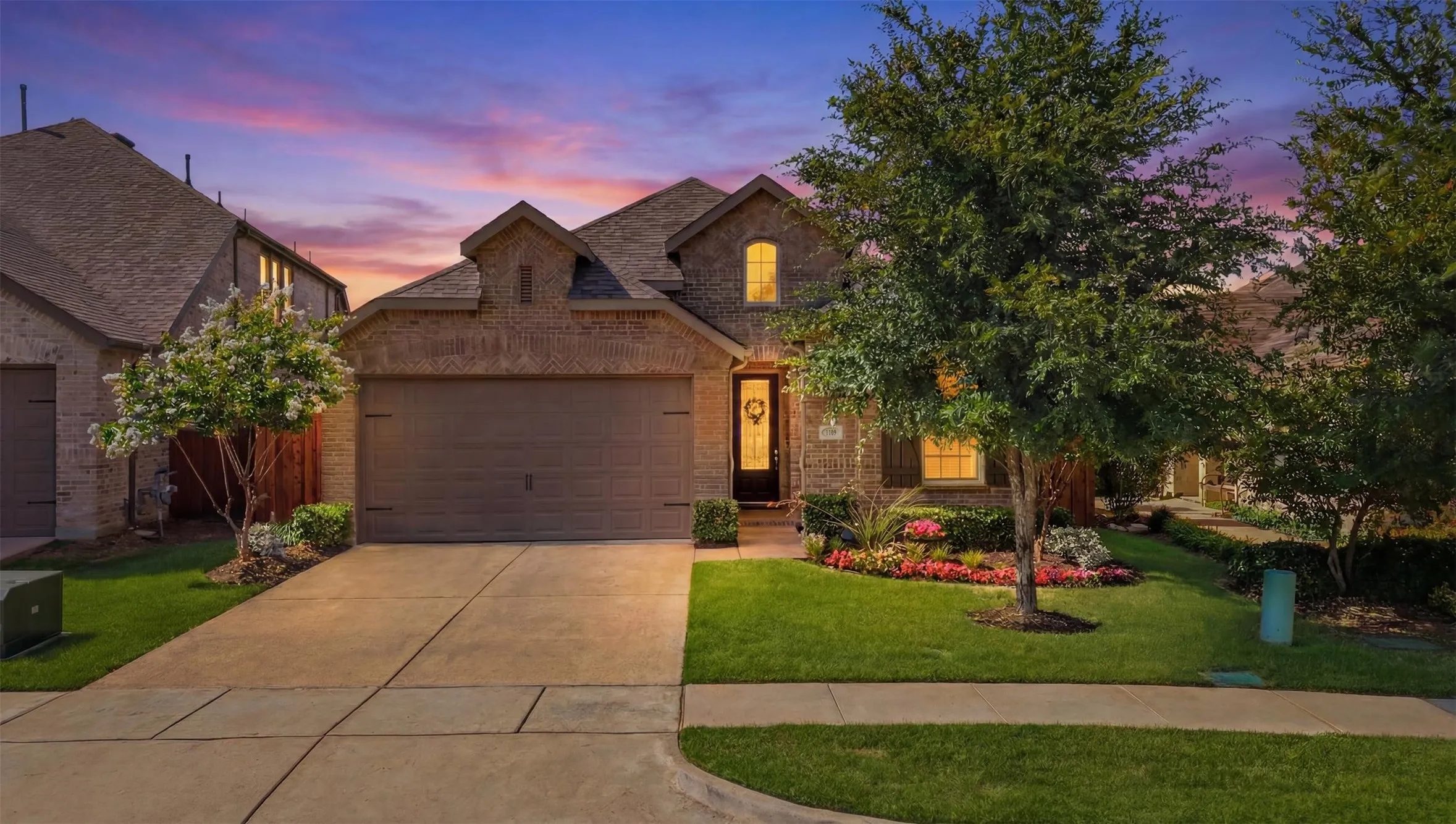 Classic single story brick construction with a 2 car attached garage and beautifully landscaped exterior.