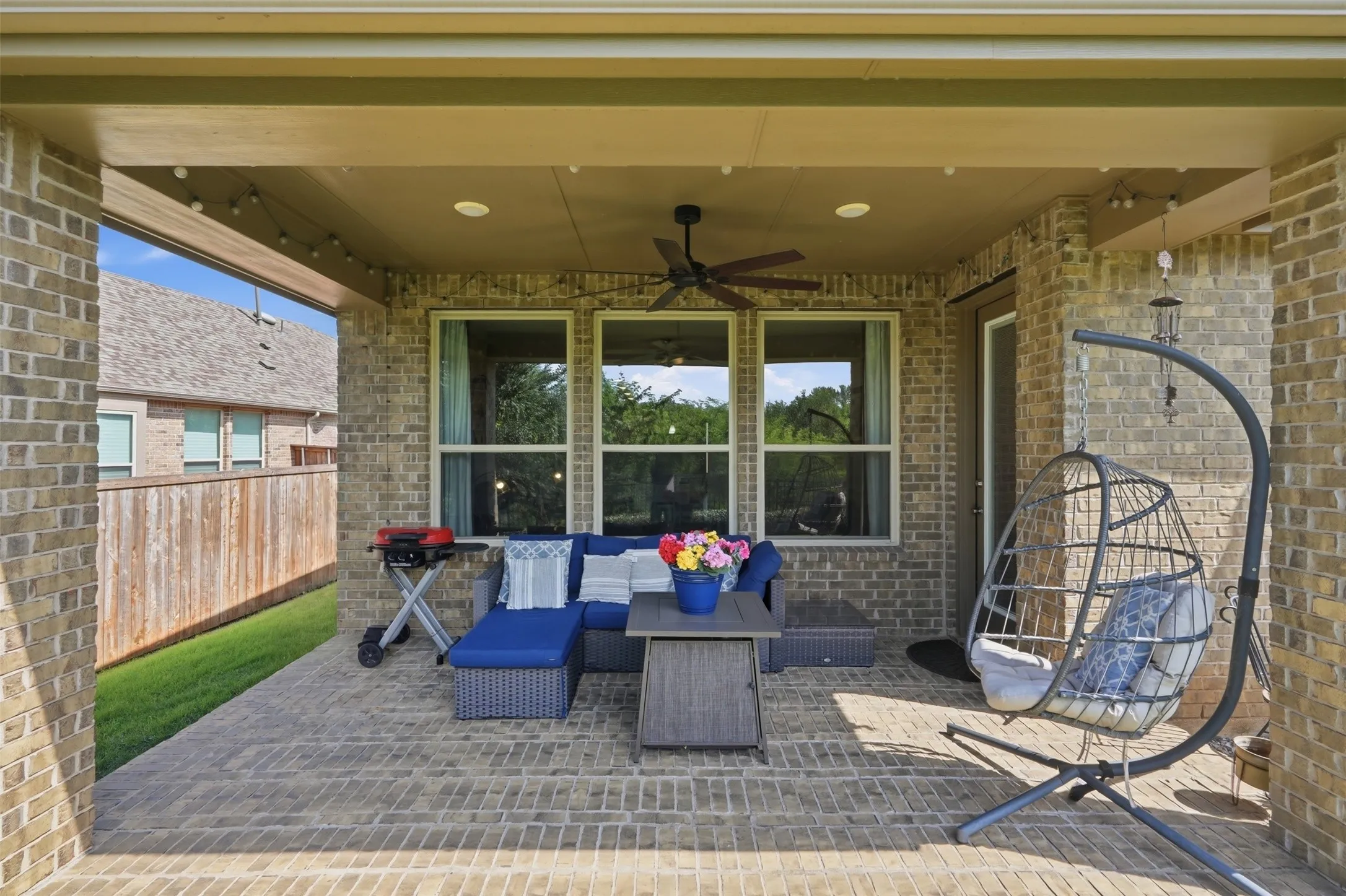This inviting covered patio is the perfect extension of your living space.