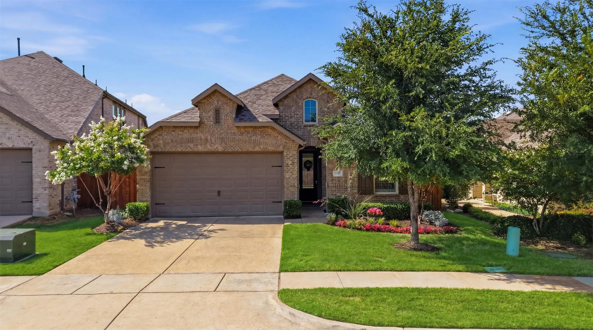 Well maintained one story brick home with a wide concrete driveway