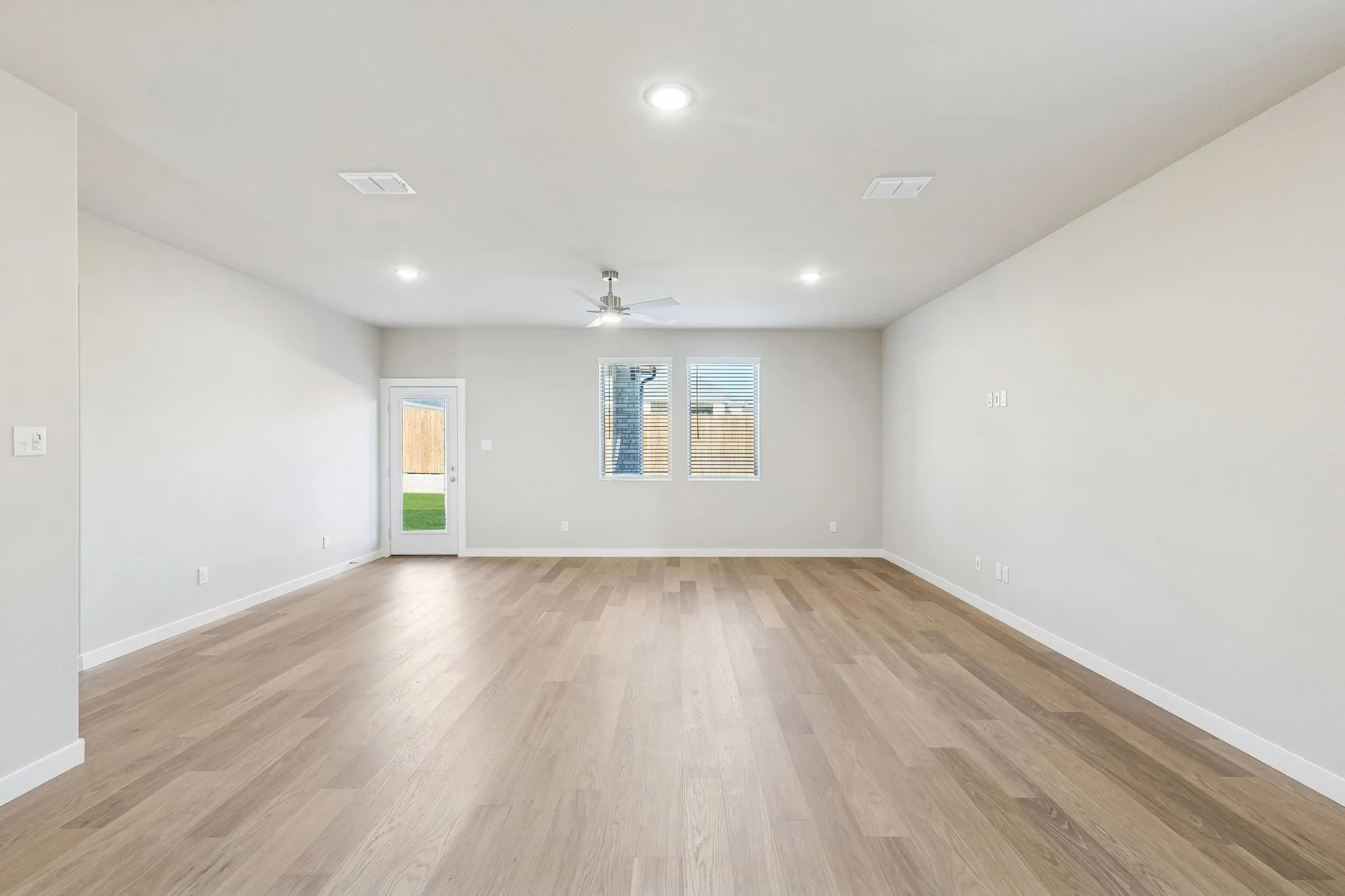Living and Dining Room in the Haylee home plan by Trophy Signature Homes - REPRESENTATIVE PHOTO