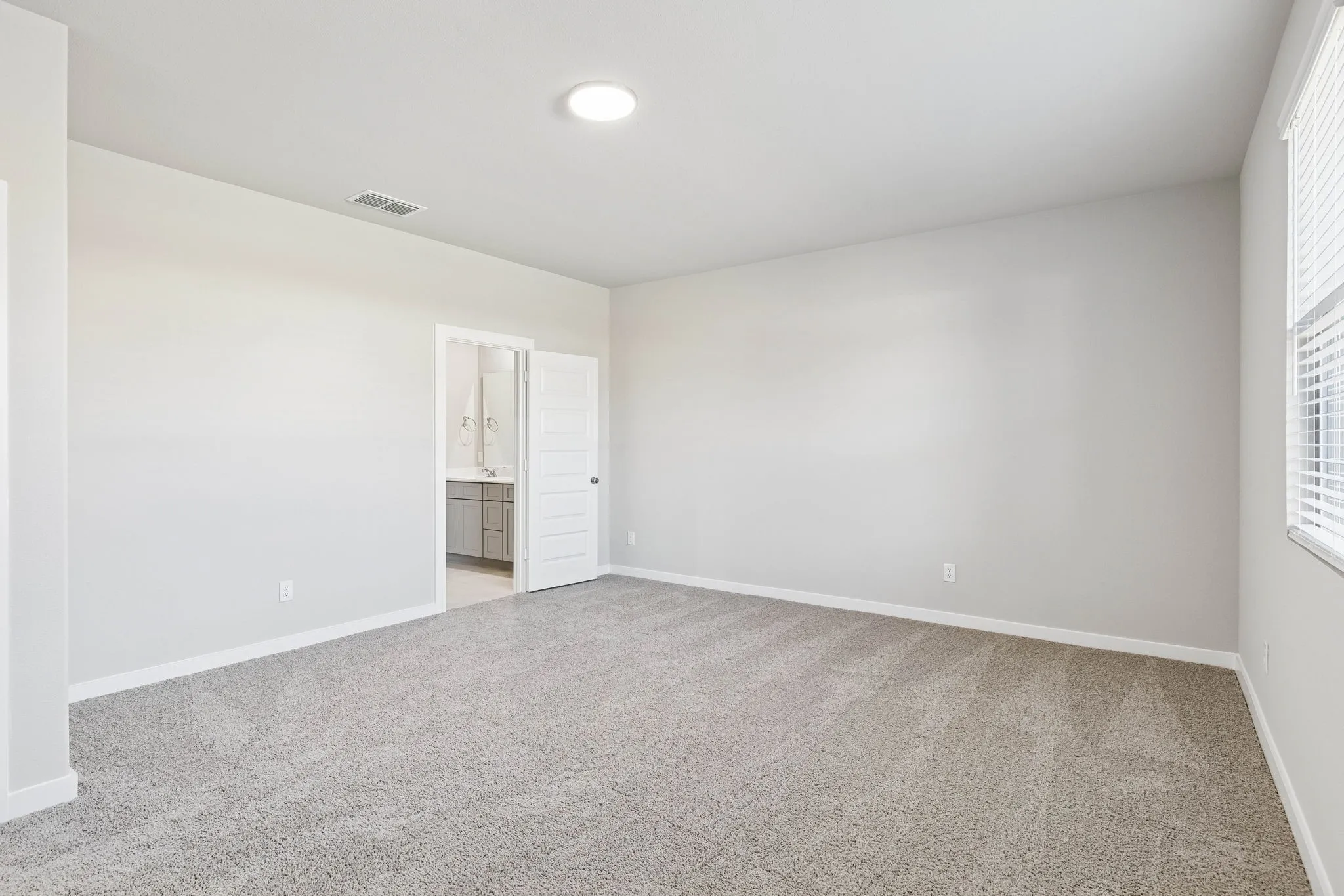 Primary Suite in the Haylee home plan by Trophy Signature Homes - REPRESENTATIVE PHOTO