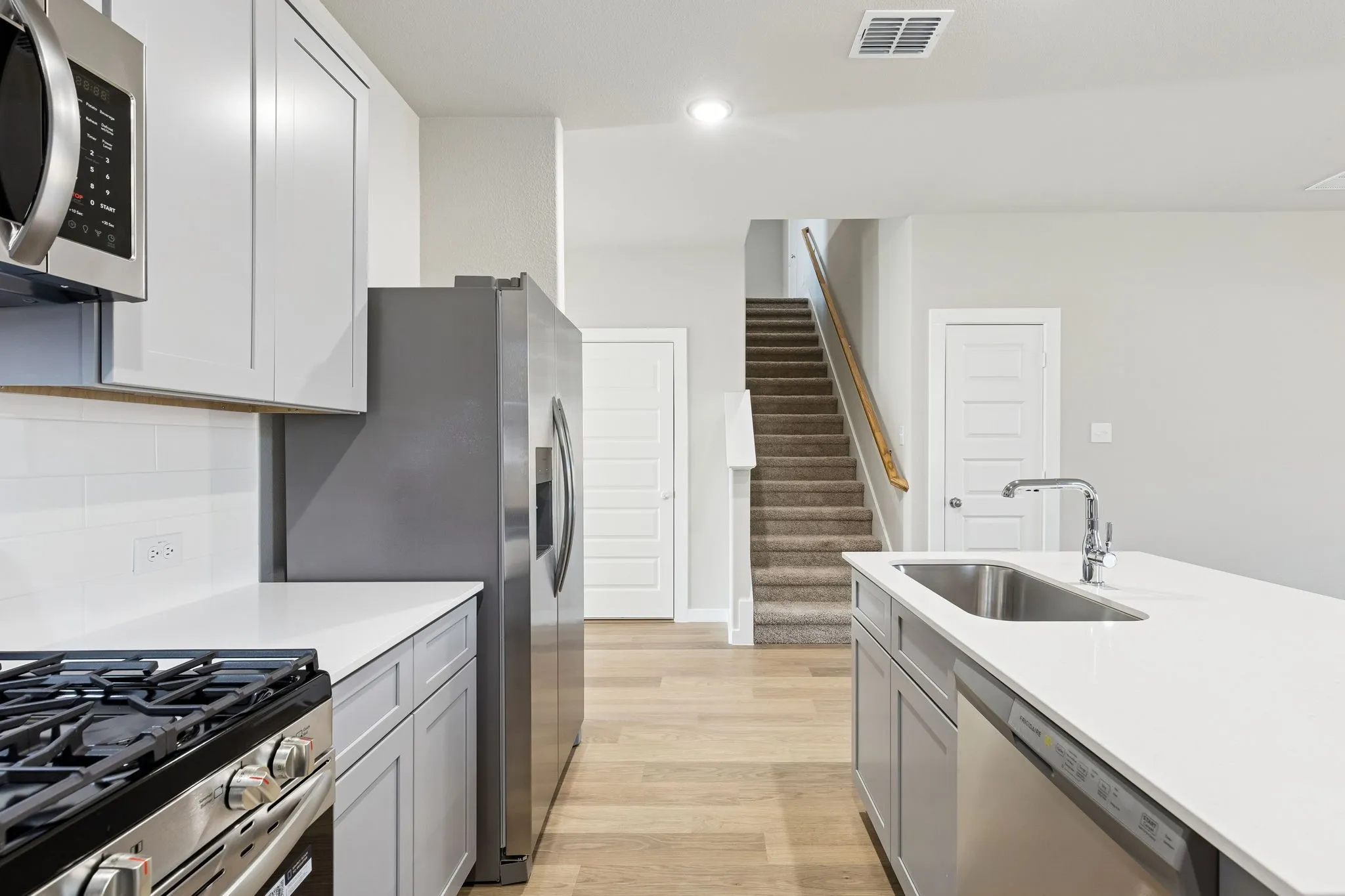 Kitchen in the Haylee home plan by Trophy Signature Homes - REPRESENTATIVE PHOTO